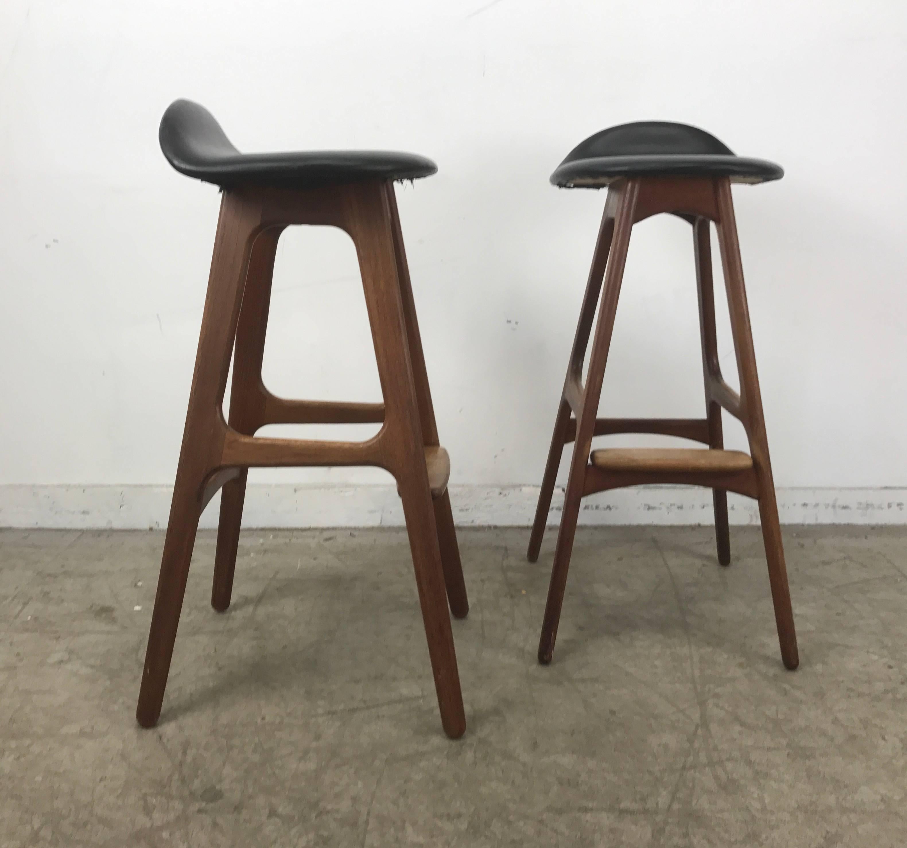 Iconic pair bar stools designed by Erik Buch, Denmark, 1970s, teak frame with upholstered sculptural seat, rounded footrest,.