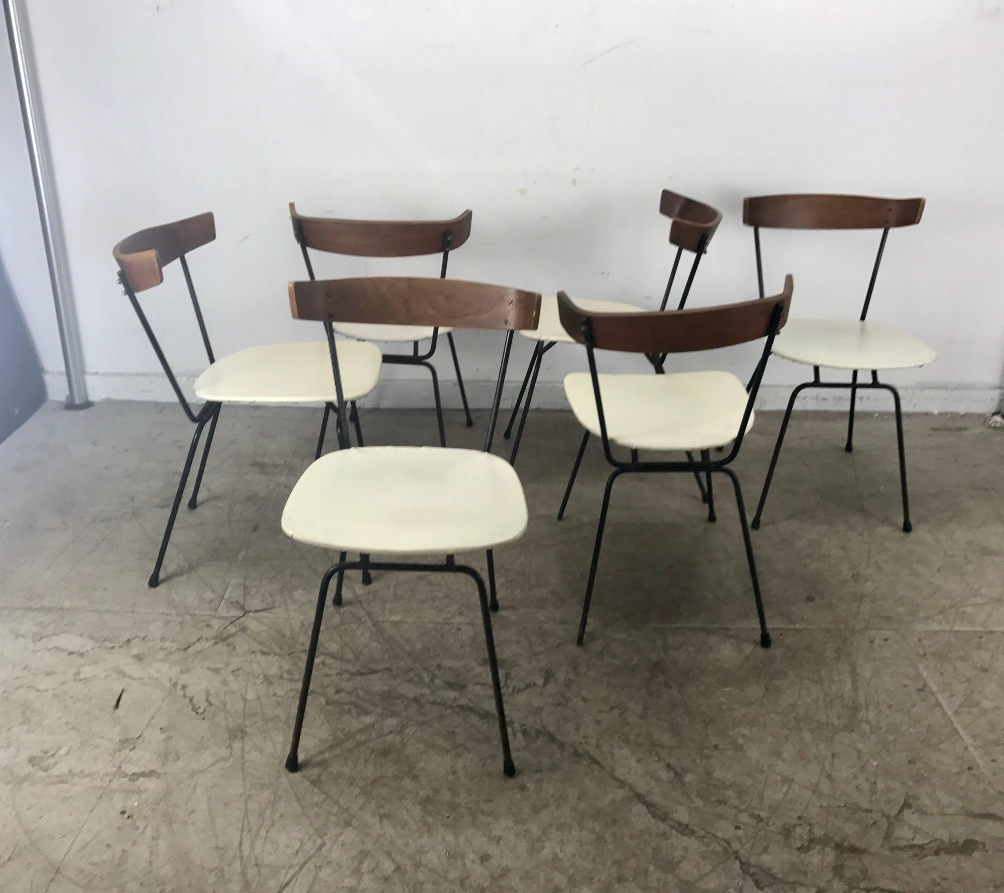 Classic set of six Mid-Century Modern dining chairs by Clifford Pascoe, sculptural wire iron and plywood construction. Usable original condition, minor wear.