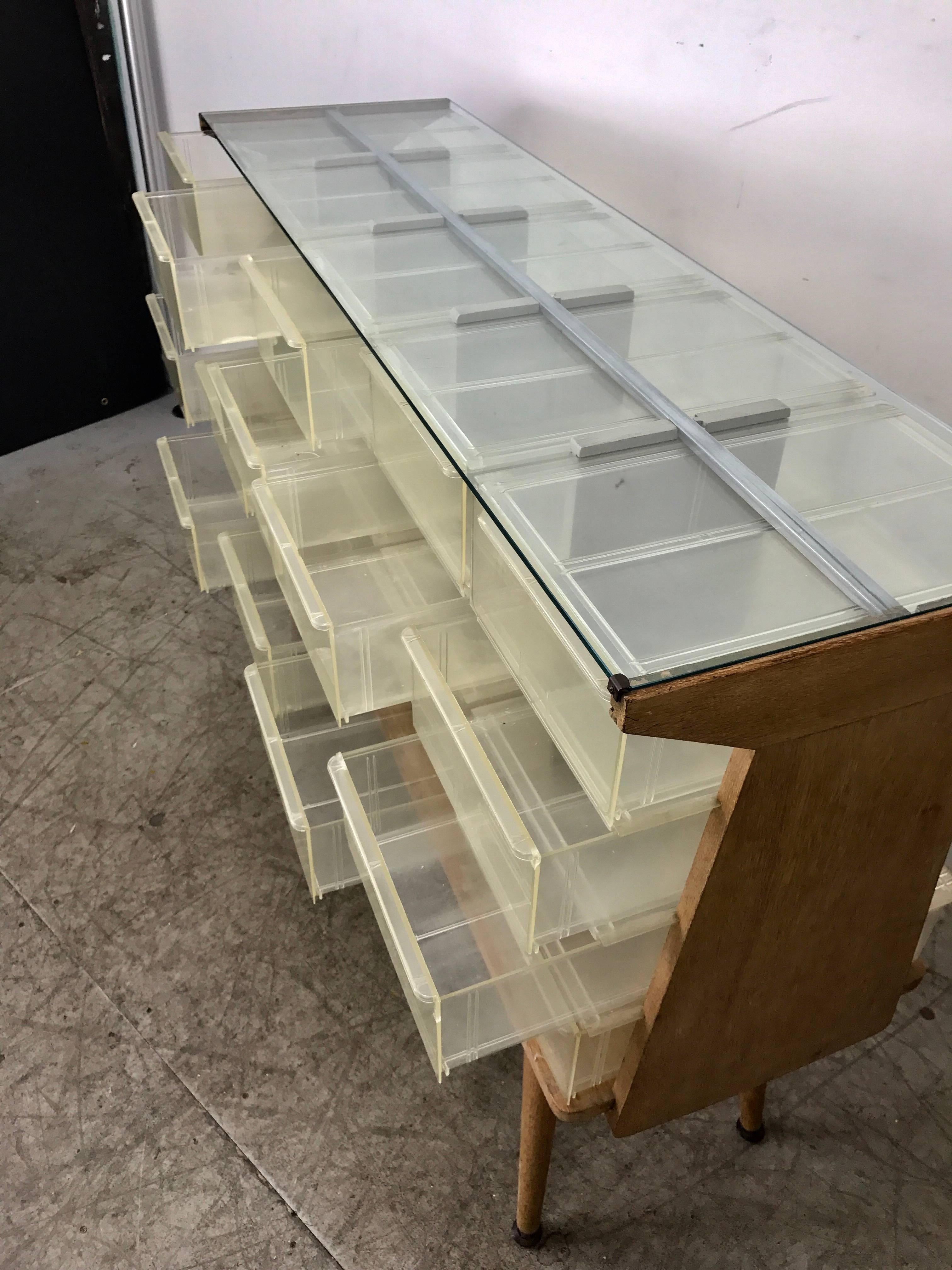 Steel Unusual Mid-Century Modern Store Fixture, Plastic, Wood and Glass, 20 Cubbies For Sale