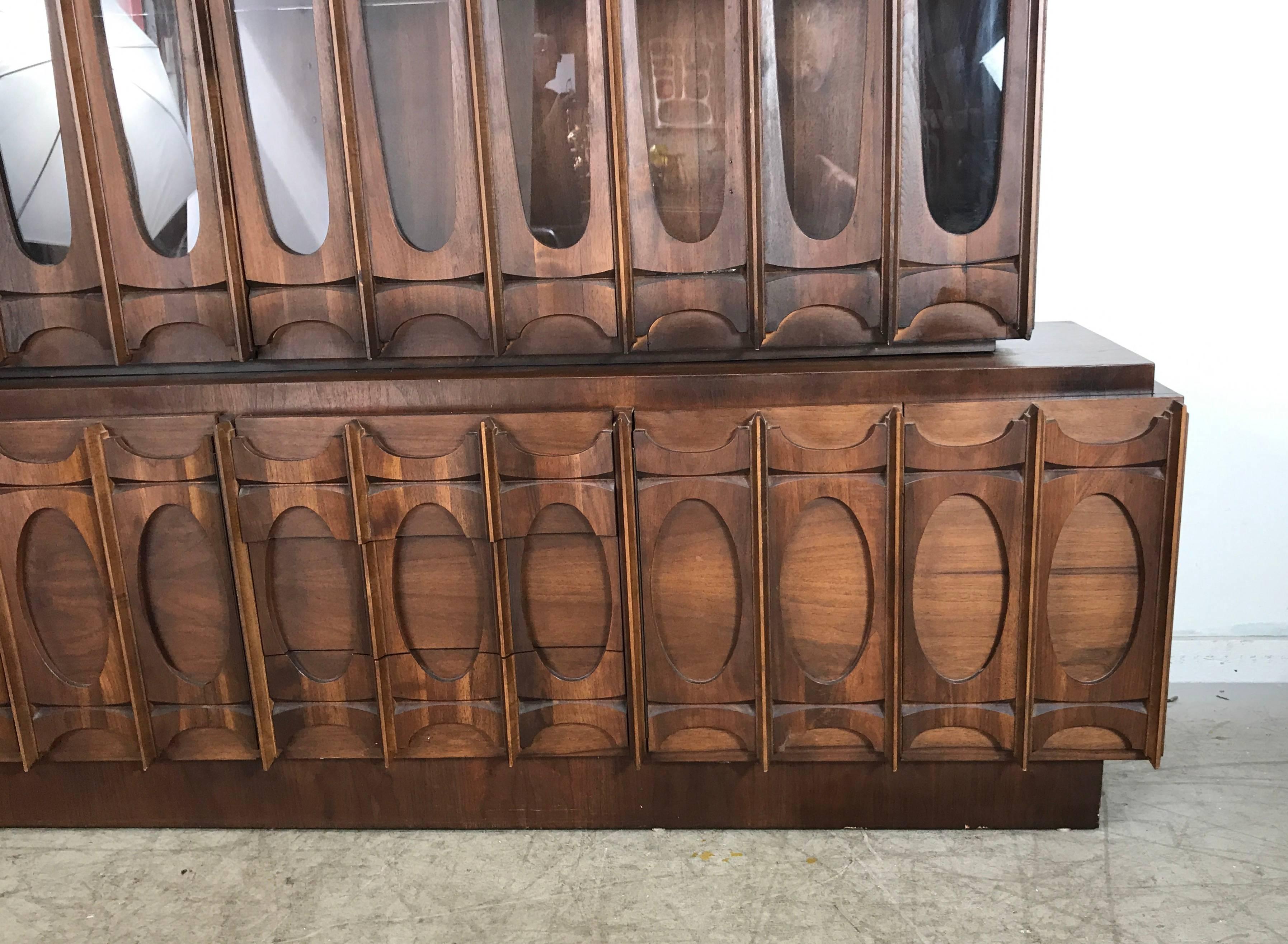 Monumental Brutalist Cabinet, Classic Mid-Century manner of Paul Evans. Stunning Architectural design. Featuring top china cabinet, right and left door with two glass shelves. Bottom credenza right and left doors three drawers. Show Stopper. Hand