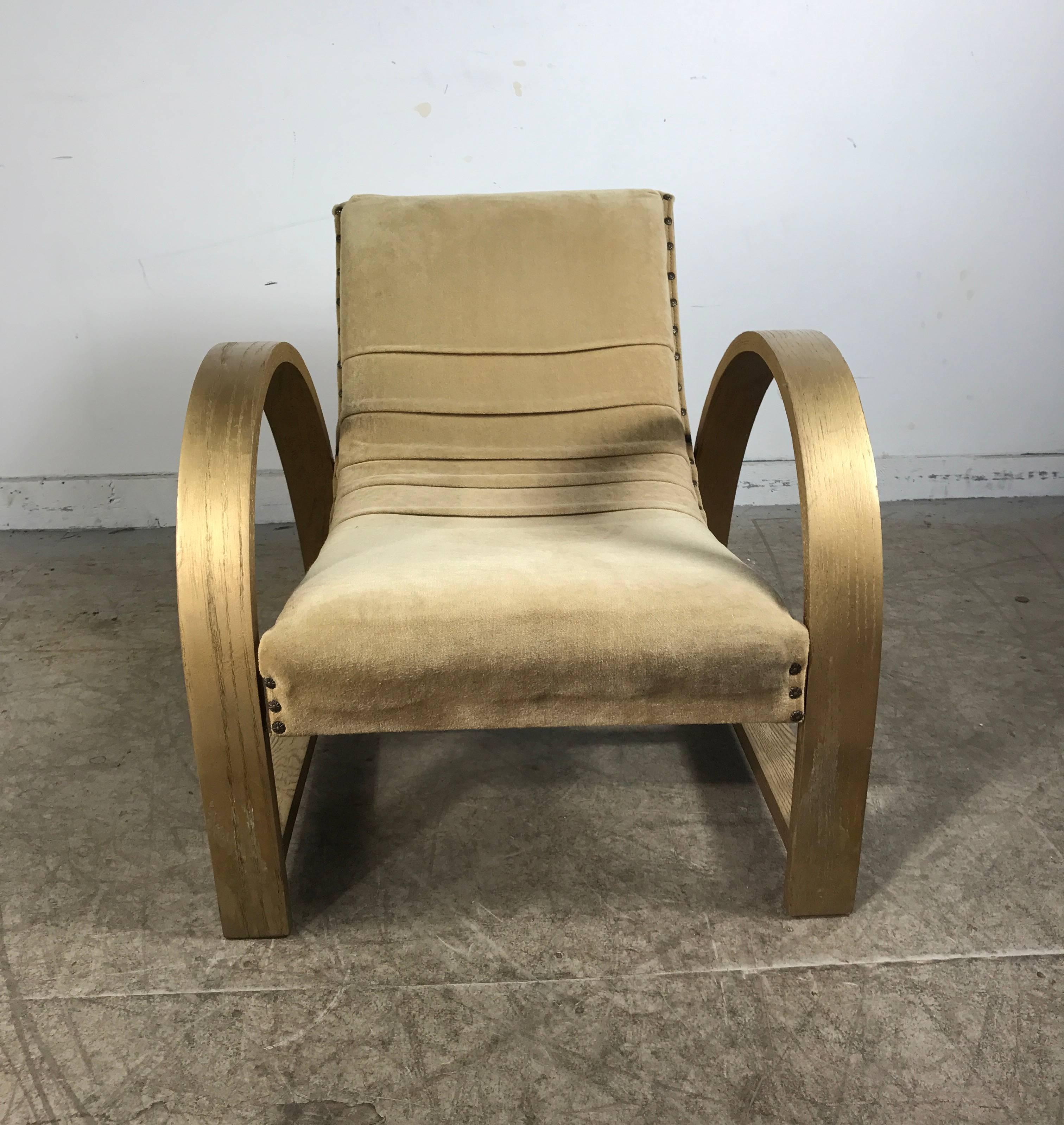 Art Deco lounge chair designed by Gilbert Rohde for Heywood Wakefield, Classic Art Deco streamline design, superior 1930s quality and heavy spring construction. Painted gold wood frame, soft velvet upholstery, extremely comfortable, amazing style.