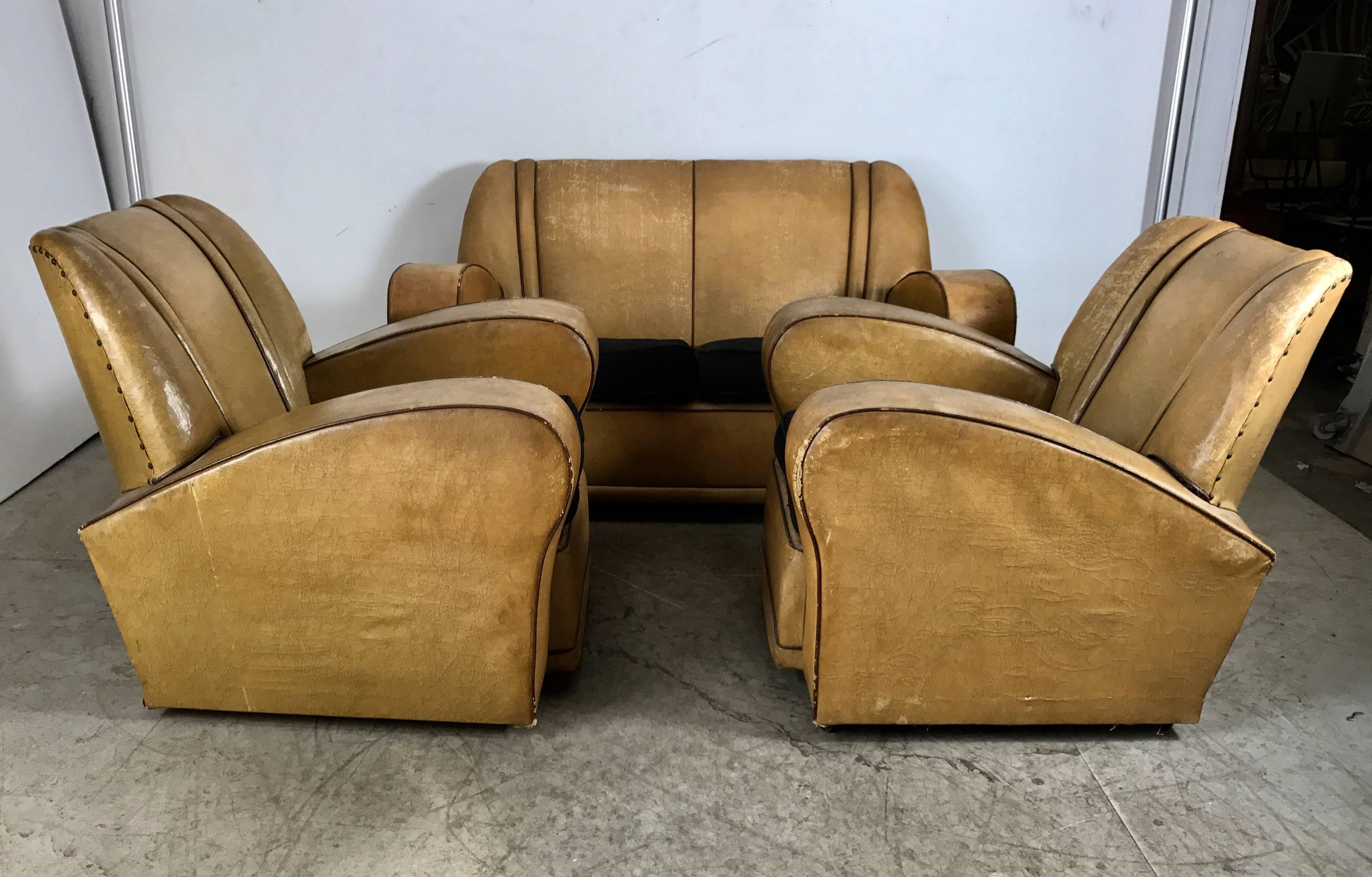 Stunning three-piece European Art Deco suite, matching sofa and two club Chairs. Classic streamline deco .Amazing design, retains original oil cloth shell. Fabric cushions, Superior quality and construction, extremely comfortable, selling in