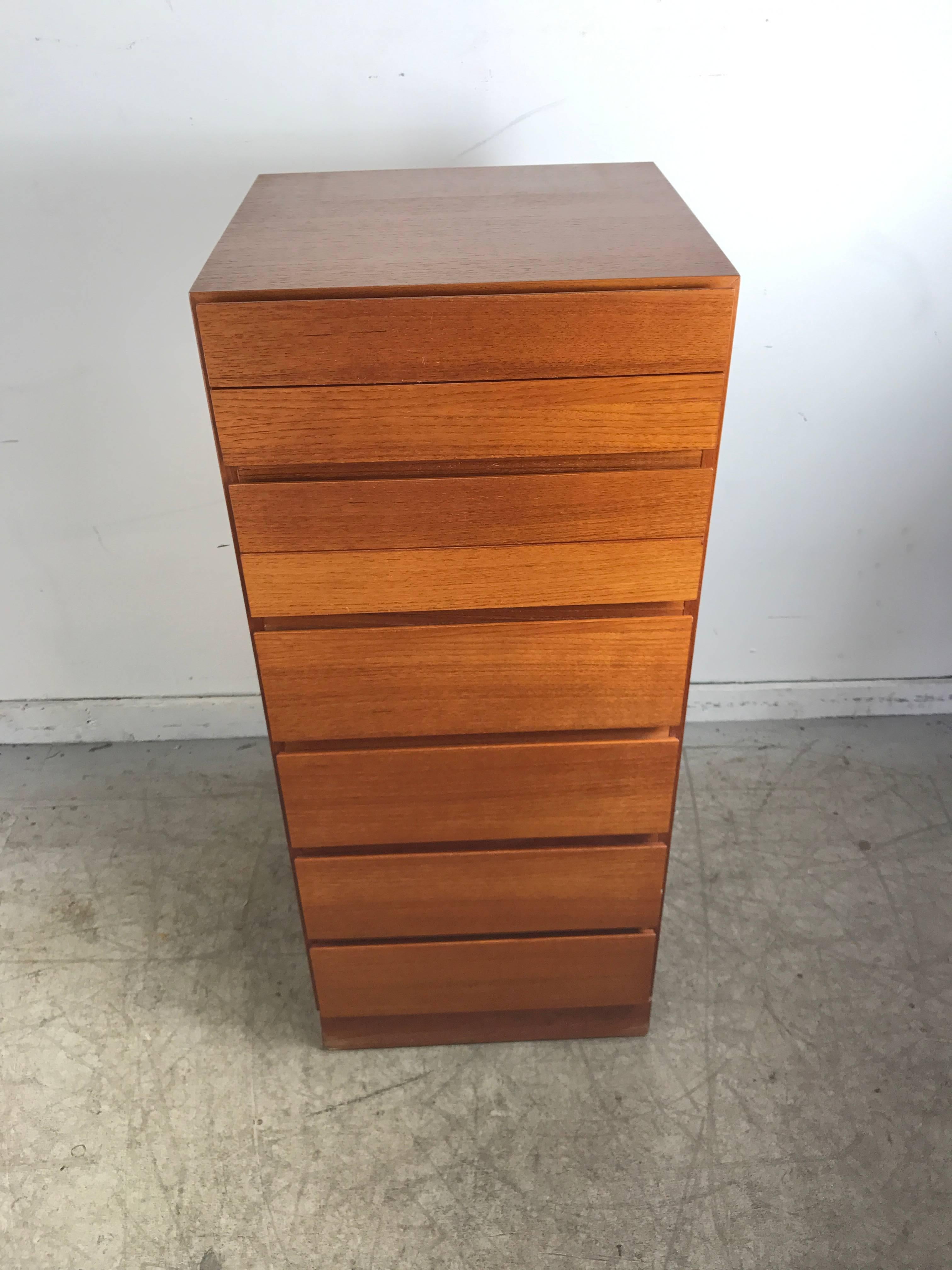 Mid-Century Modern Teak Eight-Drawer narrow Lingerie Chest, made in Denmark. Sleek simple design. Classic 