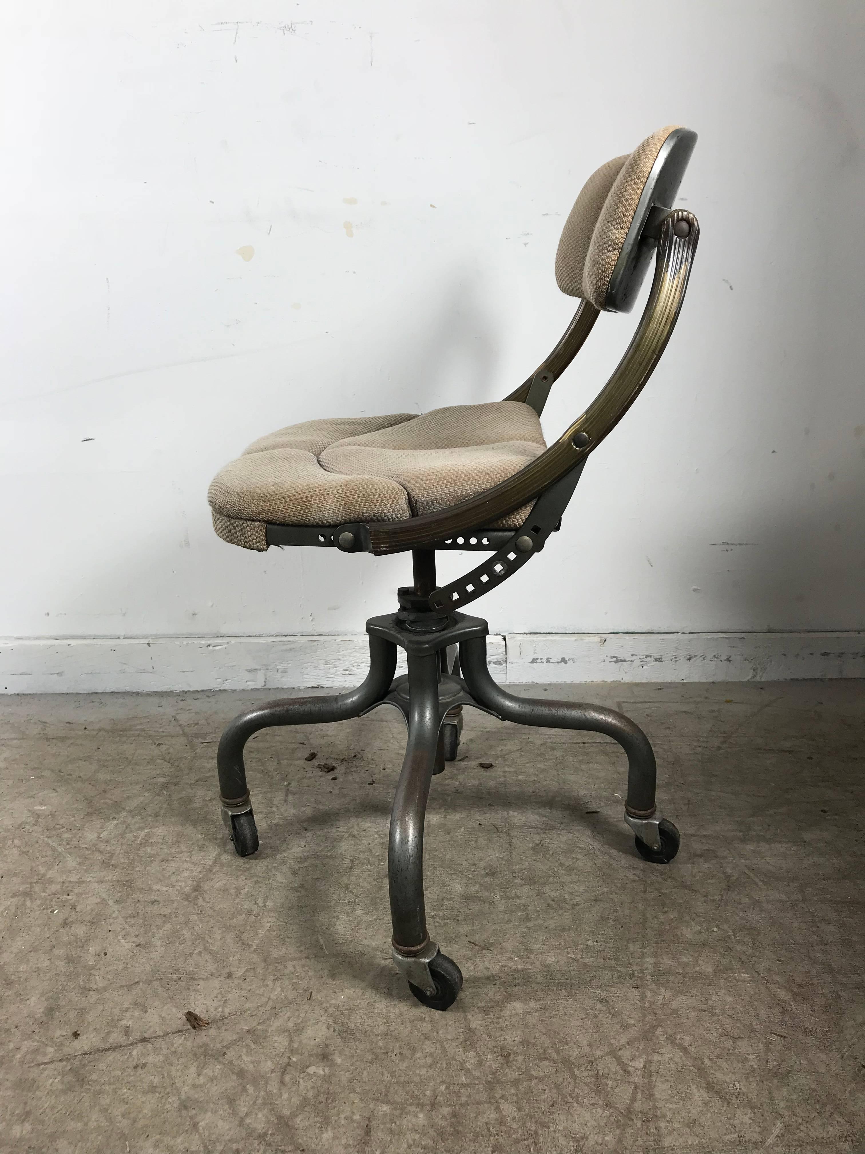 Early Industrial adjustable rolling desk chair by DoMore, nice example, retains original fabric, extremely comfortable as well as smart, simple, stylish design.