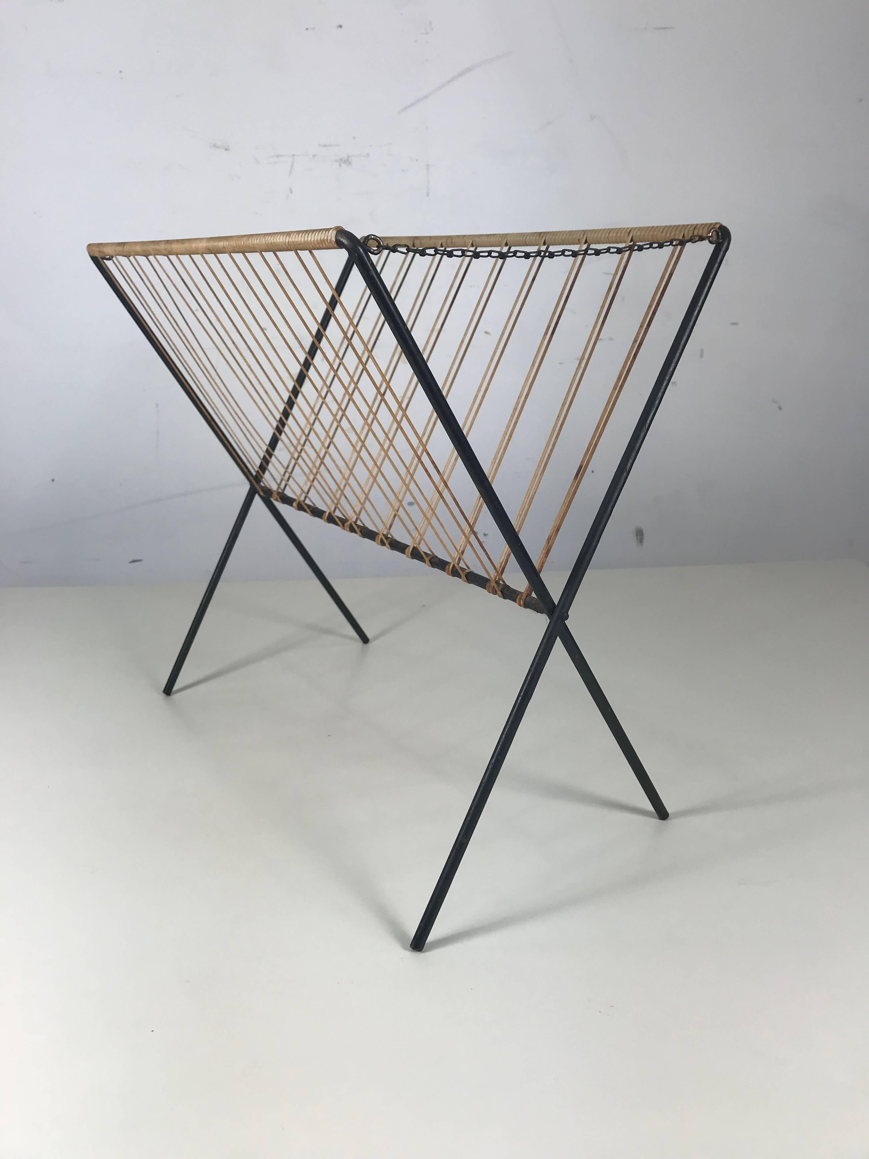 Modernist iron and jute folding magazine rack made by Tomado. Simple elegant styling.