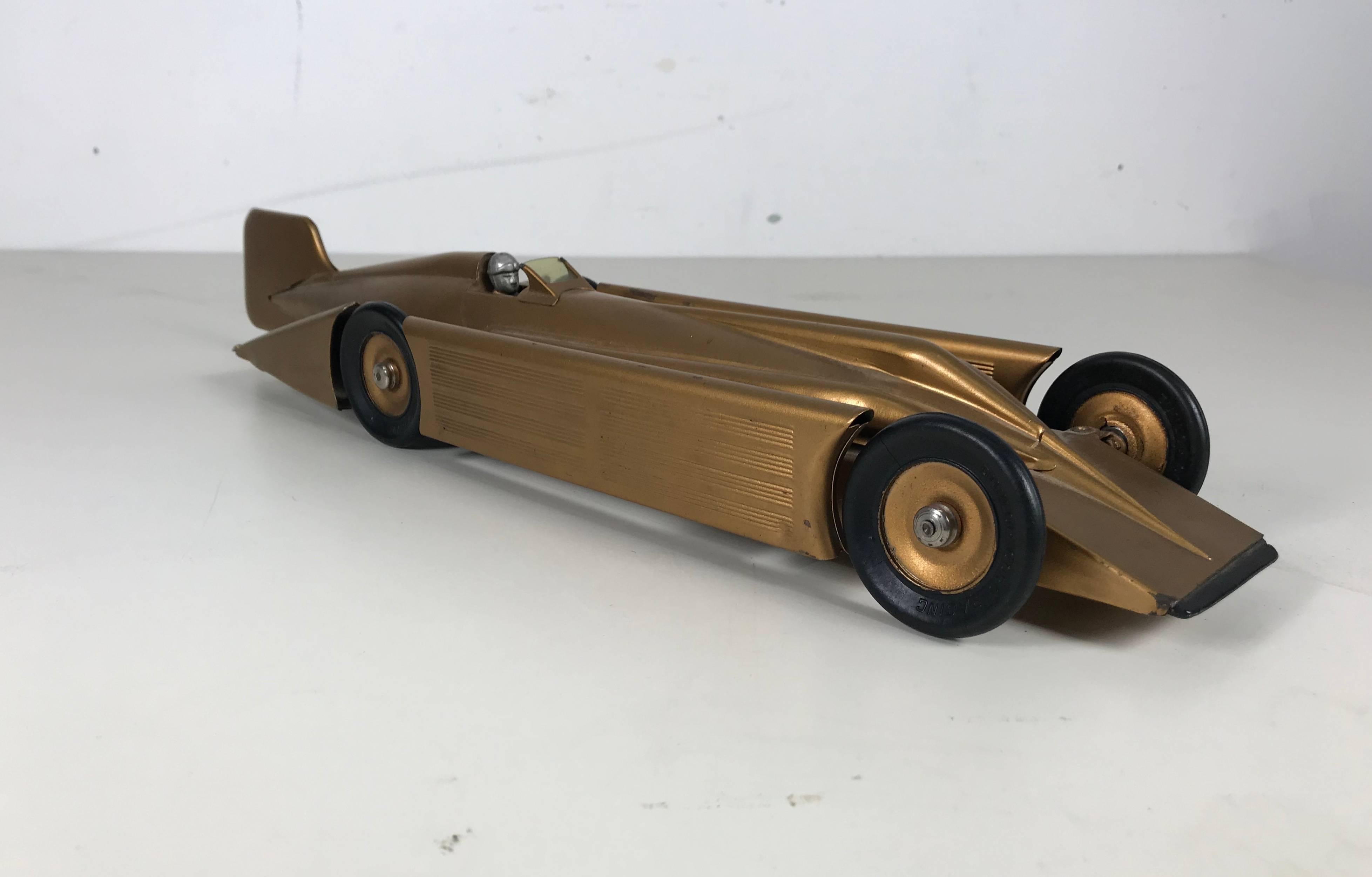 Super stylized futuristic metal car. Excellent original condition. Wind up mechanism working. Retains original decal, driver and windsheld. Amazing finish, paint, hardly used.

Kingsbury Toys

Kingsbury, the Wilkins Toy Company, manufacturer of