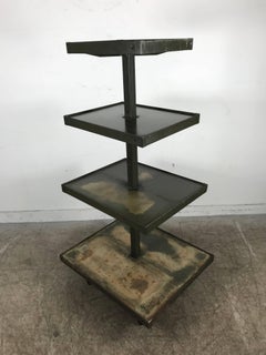 Industrial 4 tier rolling display stand, distressed finish.Dayton Display Co.