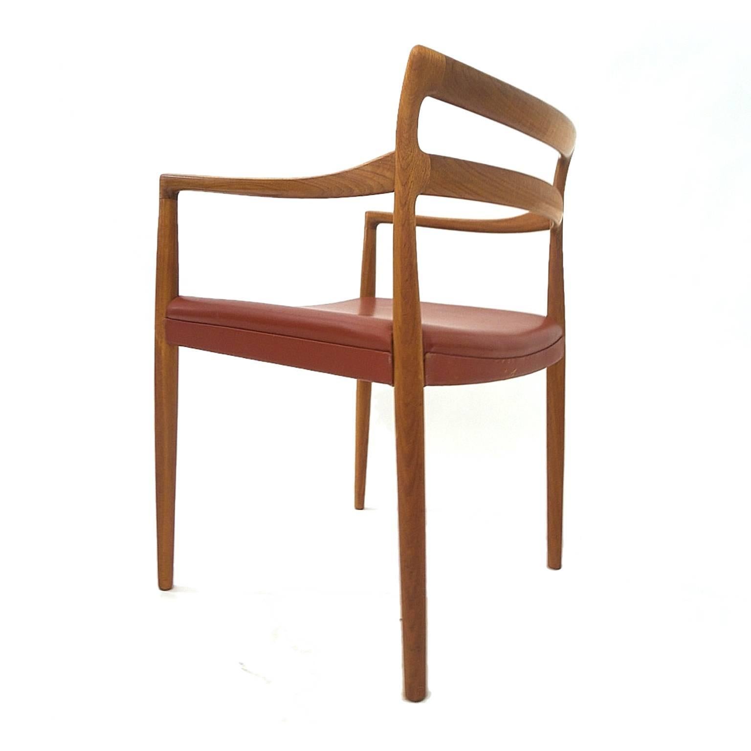 Fantastic set of six Danish modern teak dining chairs. Four side chairs and two armchairs. Sculptural teak frames with red leather seats.

Armchair is 21.25