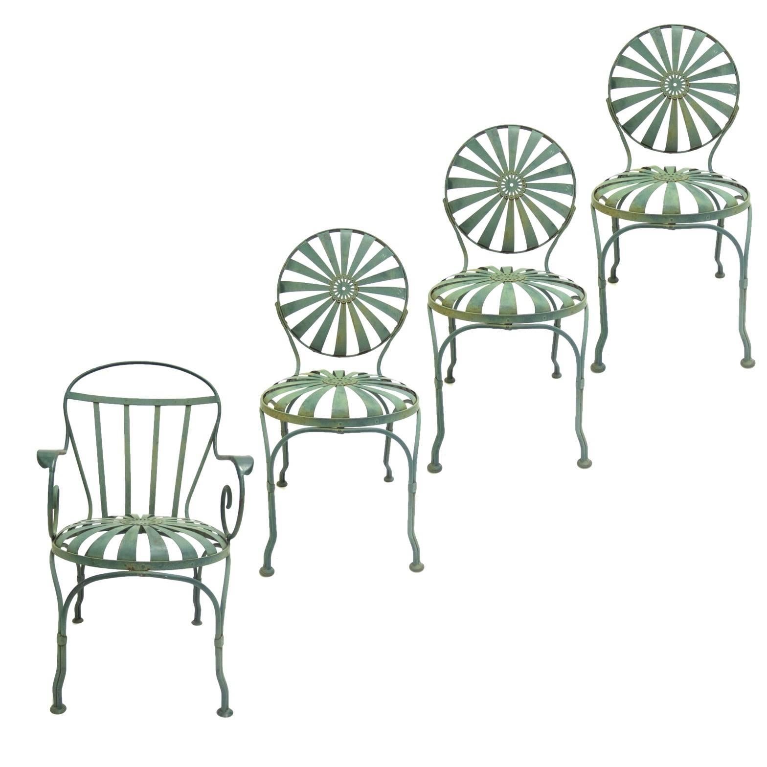 All original beautifully patinated French 1930s Francois Carre iron patio chairs.