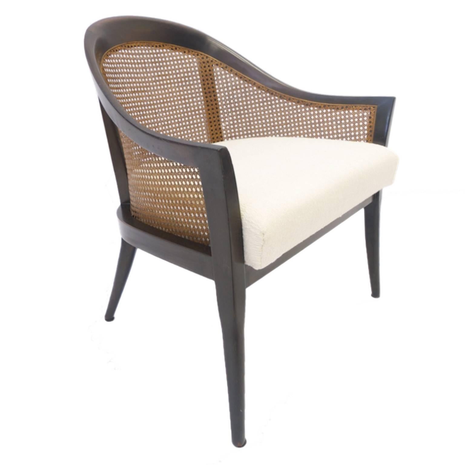 Beautiful Harvey Probber chair. Stained mahogany frame. Freshly upholstered cream colored upholstery. Beautifully caned back. Available is this single chair as well as a pair that is listed separately.