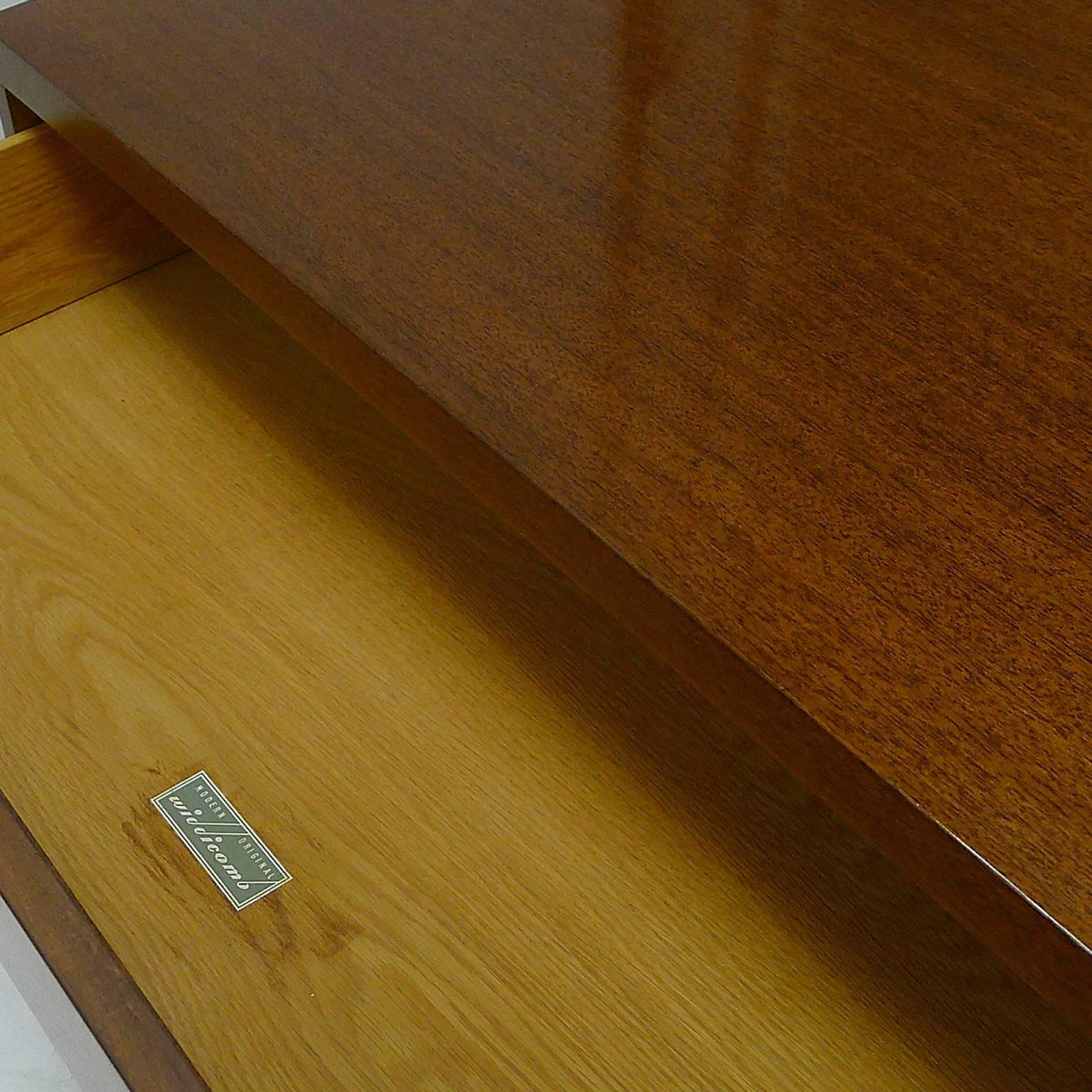 Freshly refinished pair of mahogany three-drawer dressers with brass ring pulls. This piece is part of The Widdicomb Modern Originals Flexi-Unit series (initially known as the Horizontal Vertical Sectional Modern series), a series that was made by