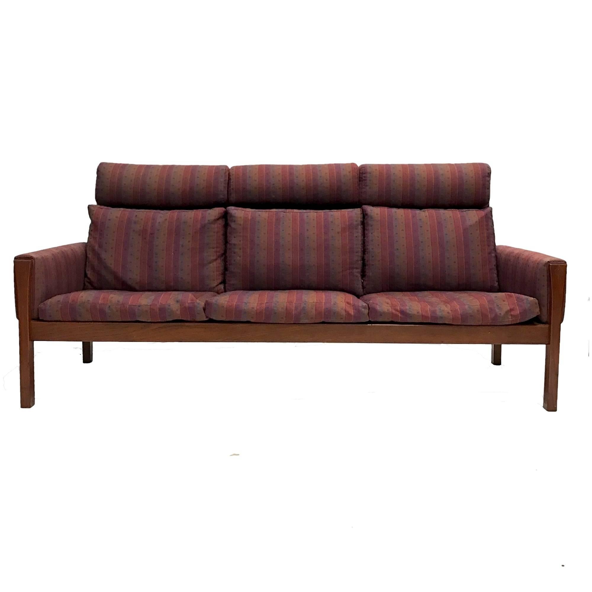 A very rare high back version of A.P. Stolen '62 Sofa' in teak. Price is low enough for reupholstery.