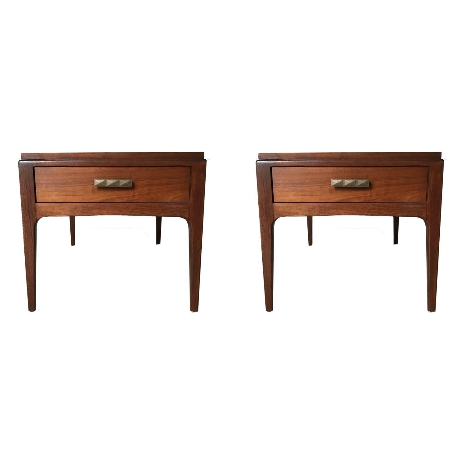 Freshly refinished sculptural pair of single drawer end tables or nightstands in walnut. Deep drawer. Great end tables or bedside tables.