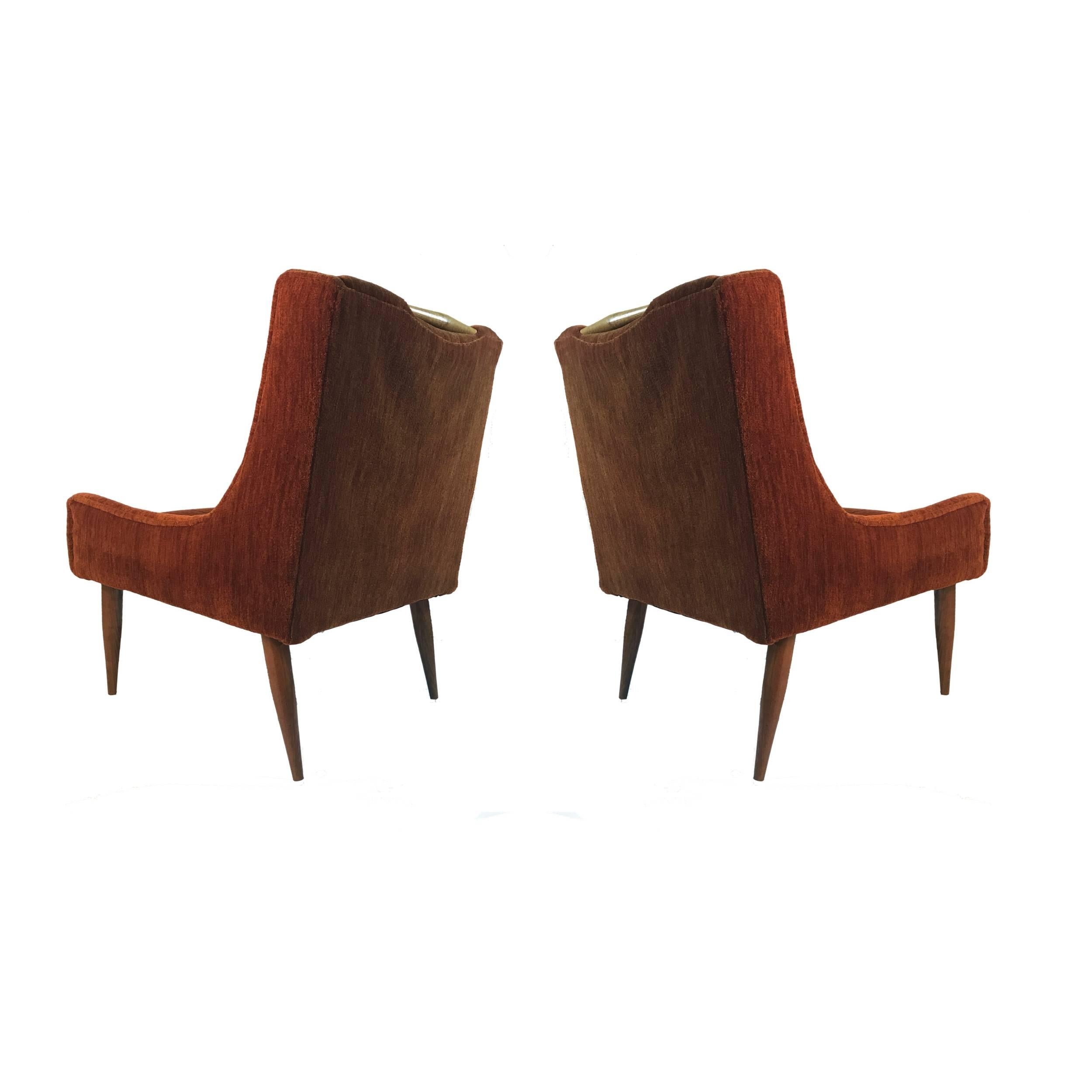 Beautiful pair of Harvey Probber chairs with walnut detail and legs. Mohair type upholstery is in good condition so can be used as they are.
Striking comfortable pair of chairs.