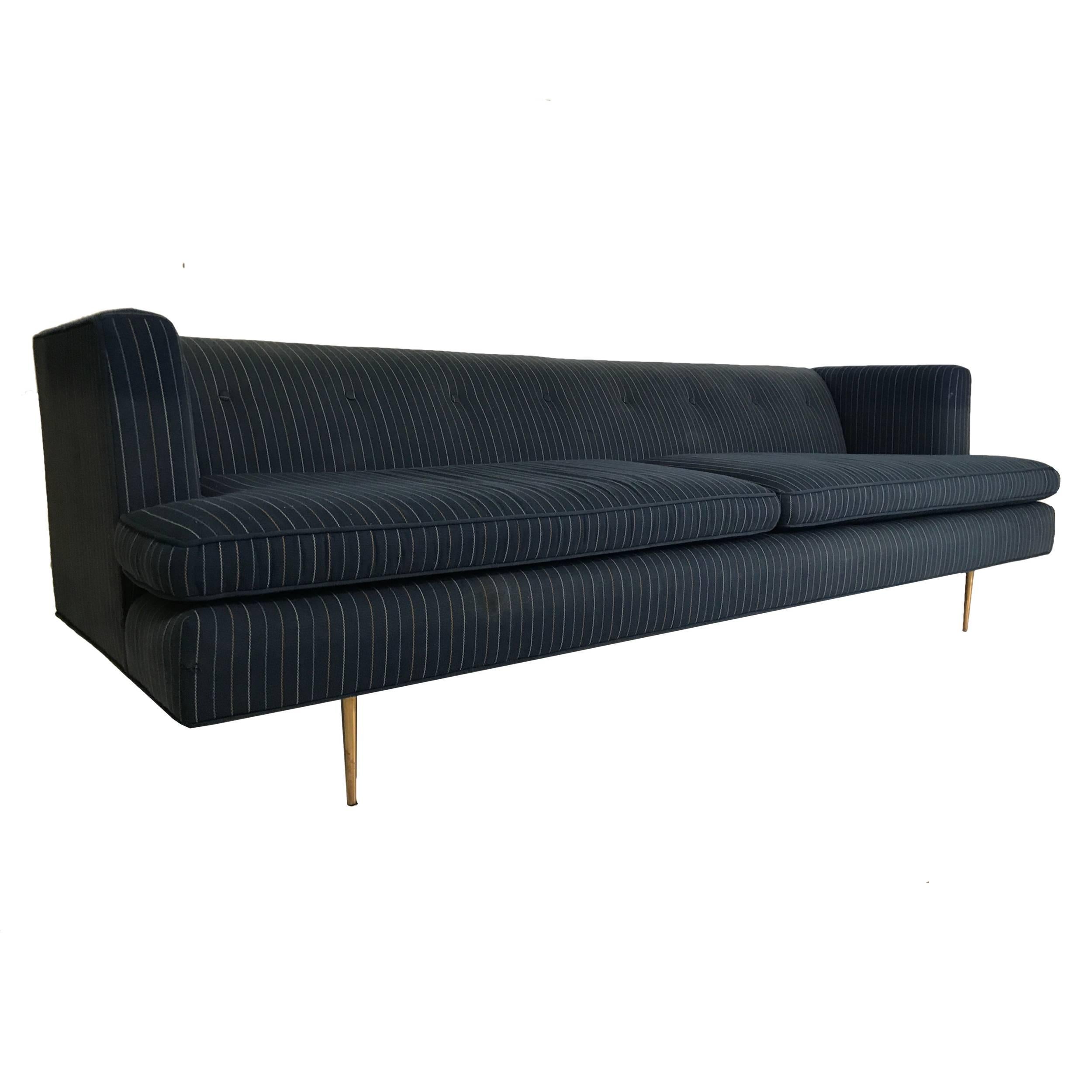 MN Originals custom 1950s sofa's are based on Edward Wormley's designs. Great original gondola or shelter style sofa with original upholstery and brass legs. Upholstery is not great and should be re-done.
