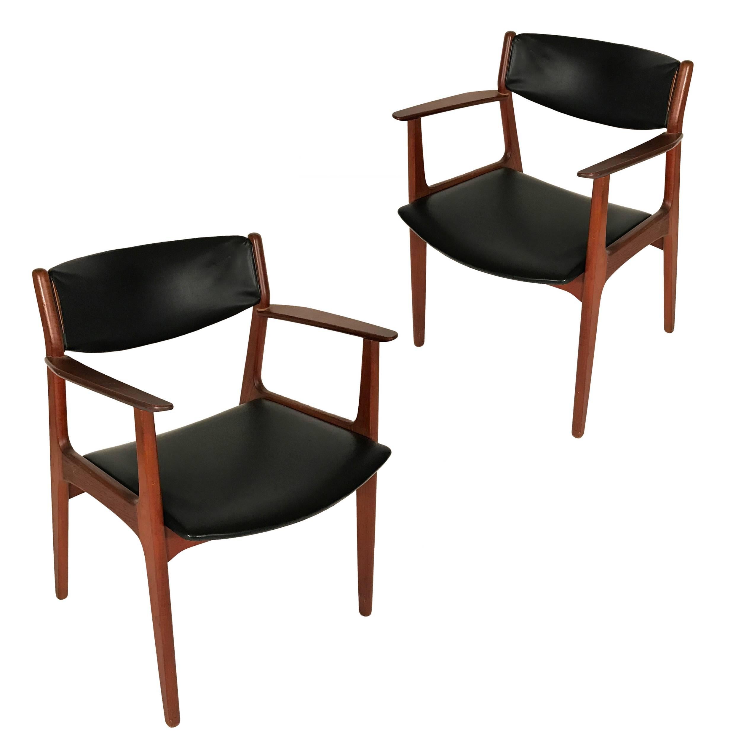 Pair of Danish chairs by George Tanier. Solid teak frames with Naugahyde seats and backs. Stunning sculptural design attributed to Arne Vodder.