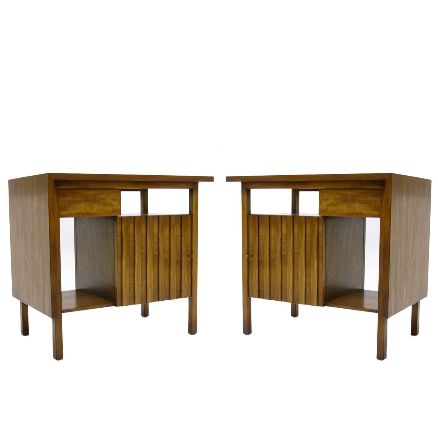 Pair of functional mahogany nightstands. Each table contains one drawer, one cabinet and two shelves.
