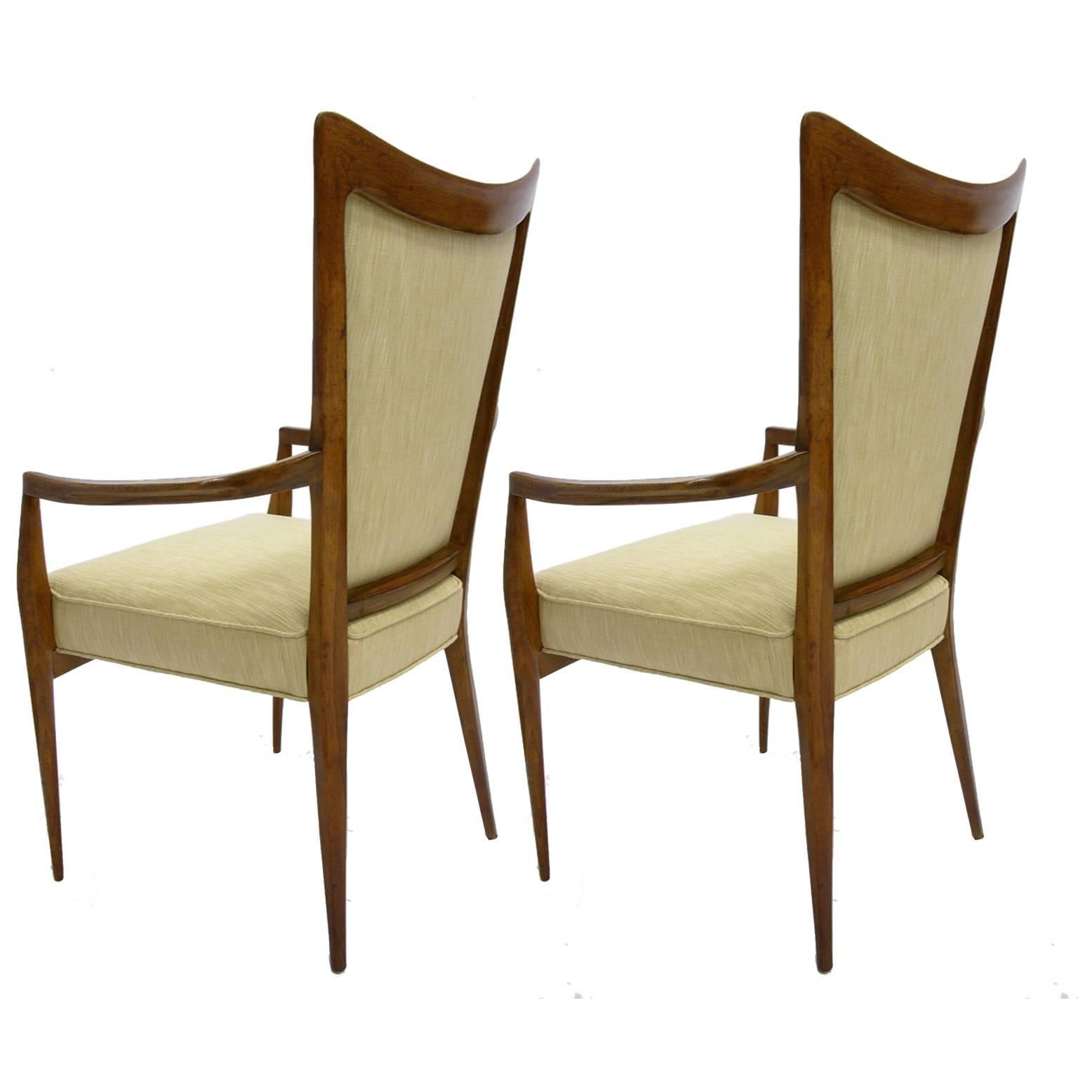 These chairs have just been upholstered with a beautiful, sturdy textured silk upholstery with gorgeous double piping detail. Gorgeous, sleek design.