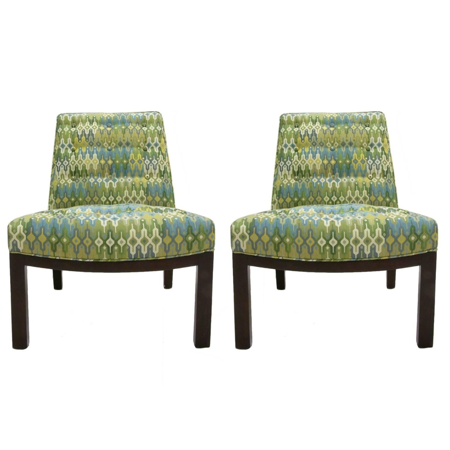 Stunning pair of freshly upholstered slipper chairs designed by Edward Wormley for Dunbar. Upholstered in a grand geometric print silken upholstery.