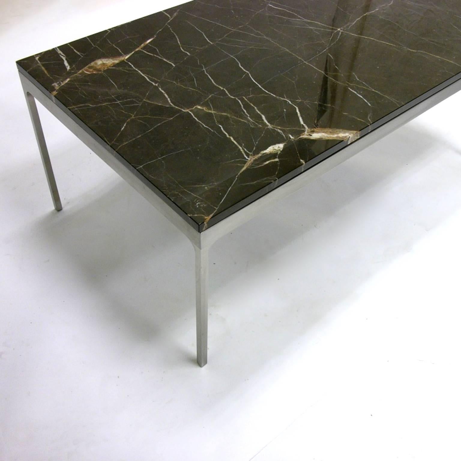 Nicos Zographos designed the Thirty-Five series table in 1960 and remains a current looking design today. Brushed steel base and stunning polished nero marquina top.