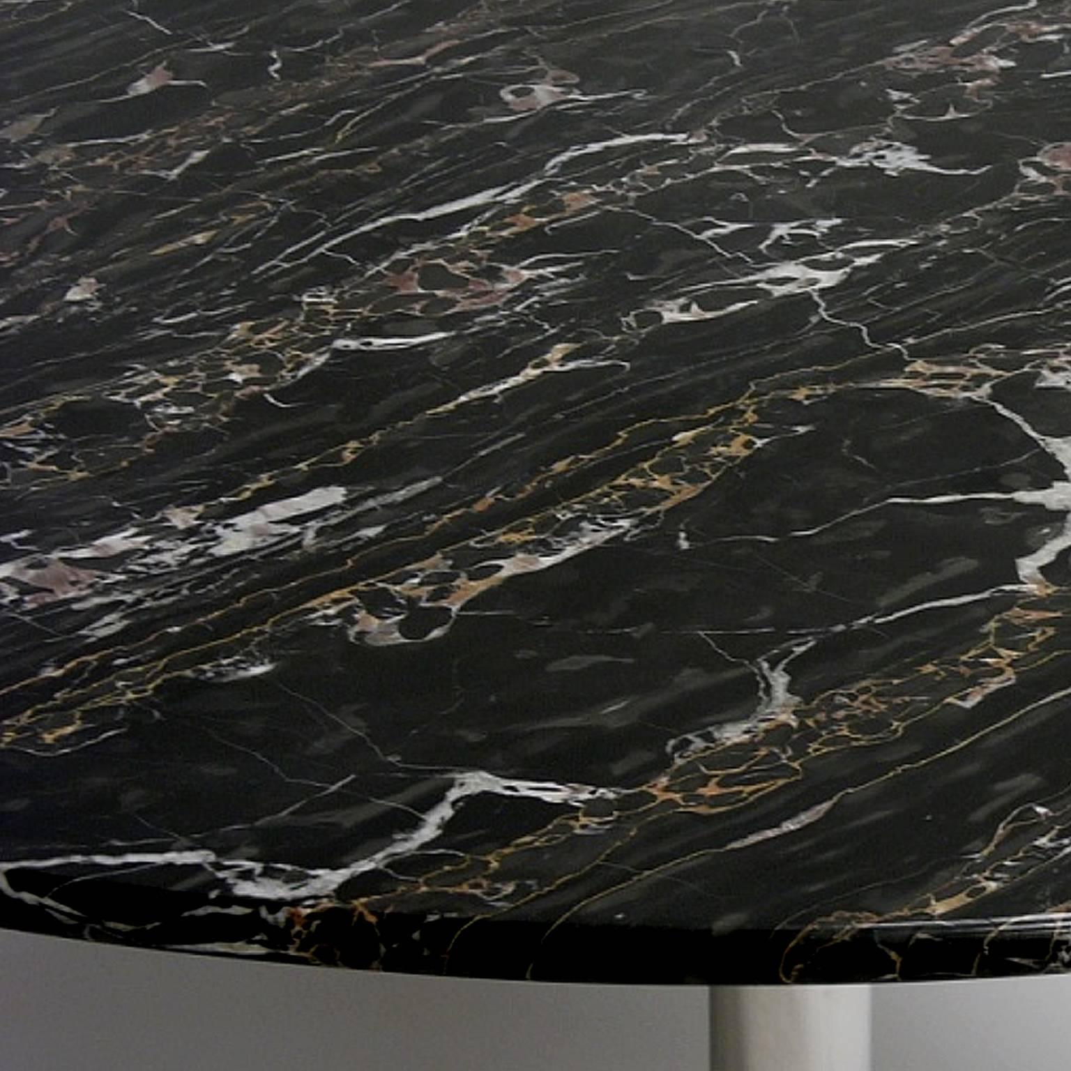 Stunning heavily decorative black marble top with a heavy polished base. Signed Nicos Zographos on base.