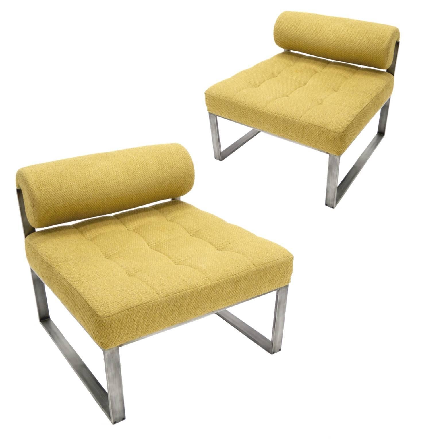Stunning pair of original bolster back lounge chairs with polished aluminum frames designed by Harvey Probber. Original oatmeal textured upholstery in a neutral tan color.