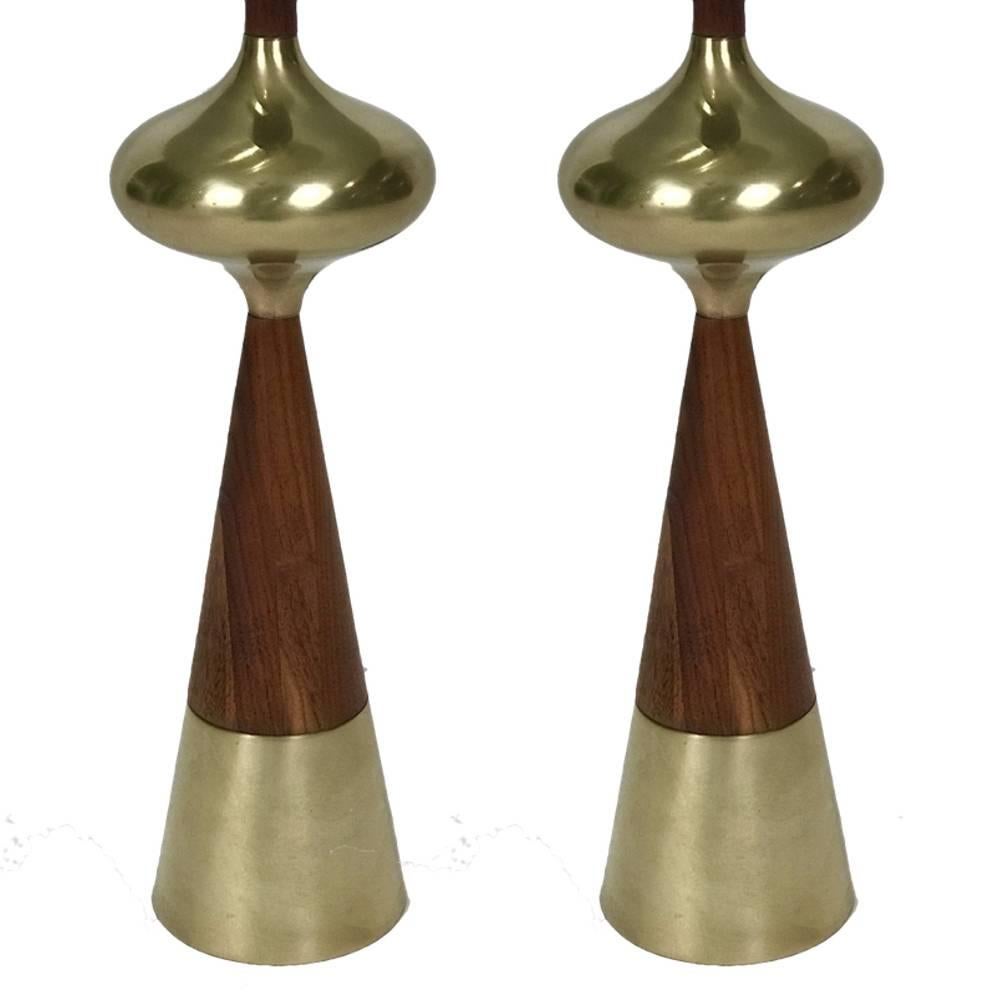 Stunning pair of Tony Paul lamps from Westwood Industries with a sculptural form walnut base. Shades are new and wiring is original but in good working order.