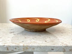 Antique Provençal Earthenware Tourne-Omelette with swivel motif