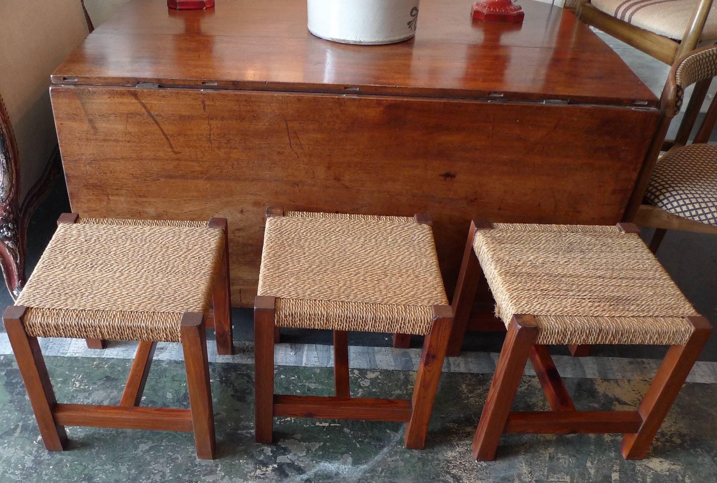 Set of three French 19th century wood and rush stools. 
