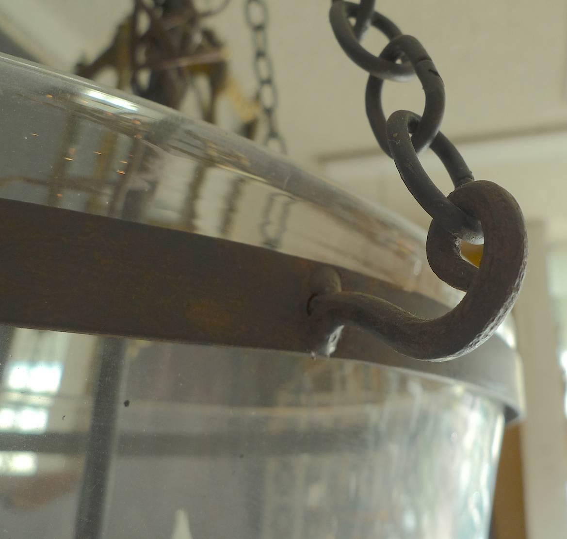French 19th century frosted “Bell Jar" pendant with contemporary iron chain fittings and three-light cluster.
 