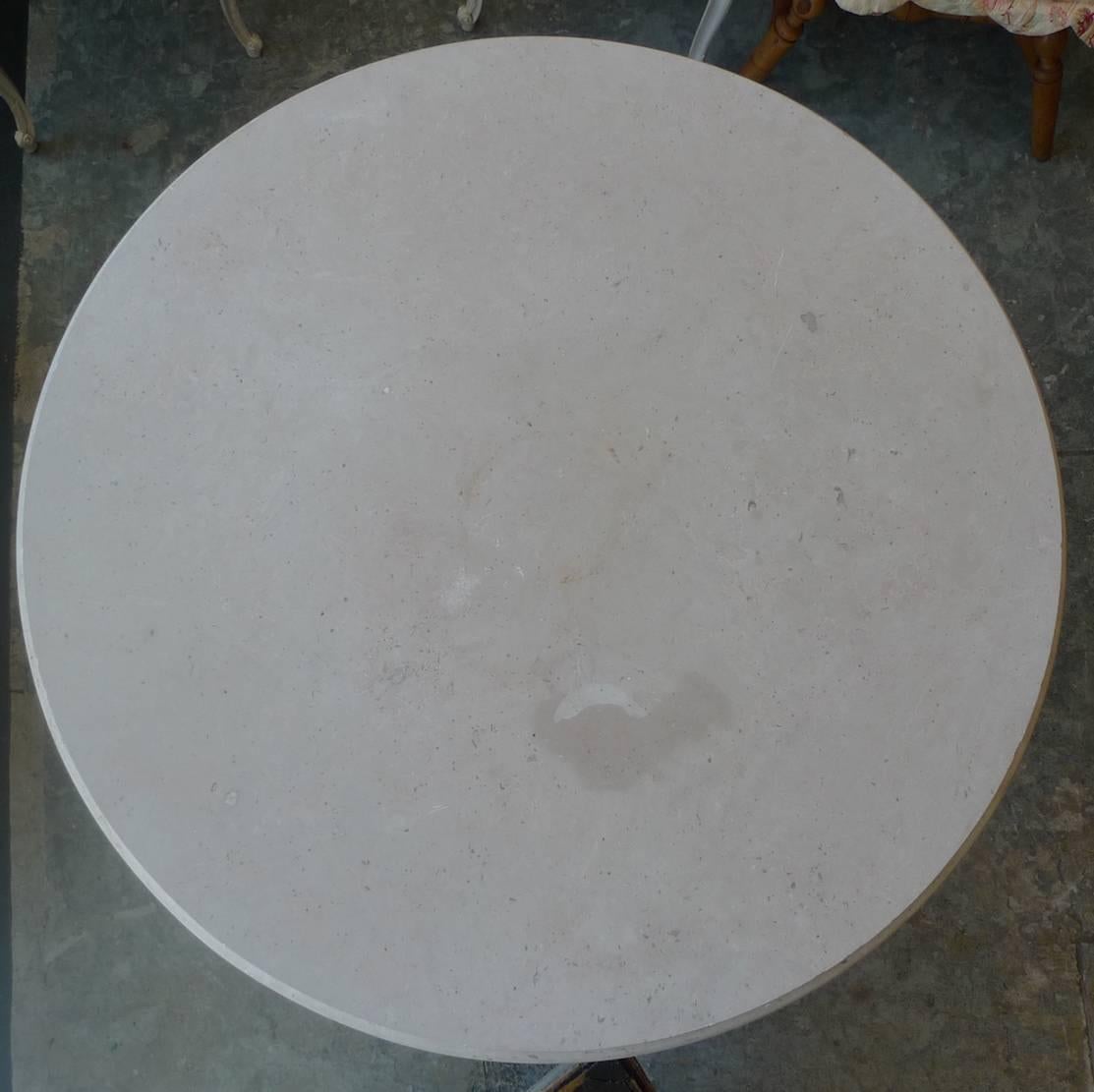 French 19th century round stone table top on painted white iron stand.