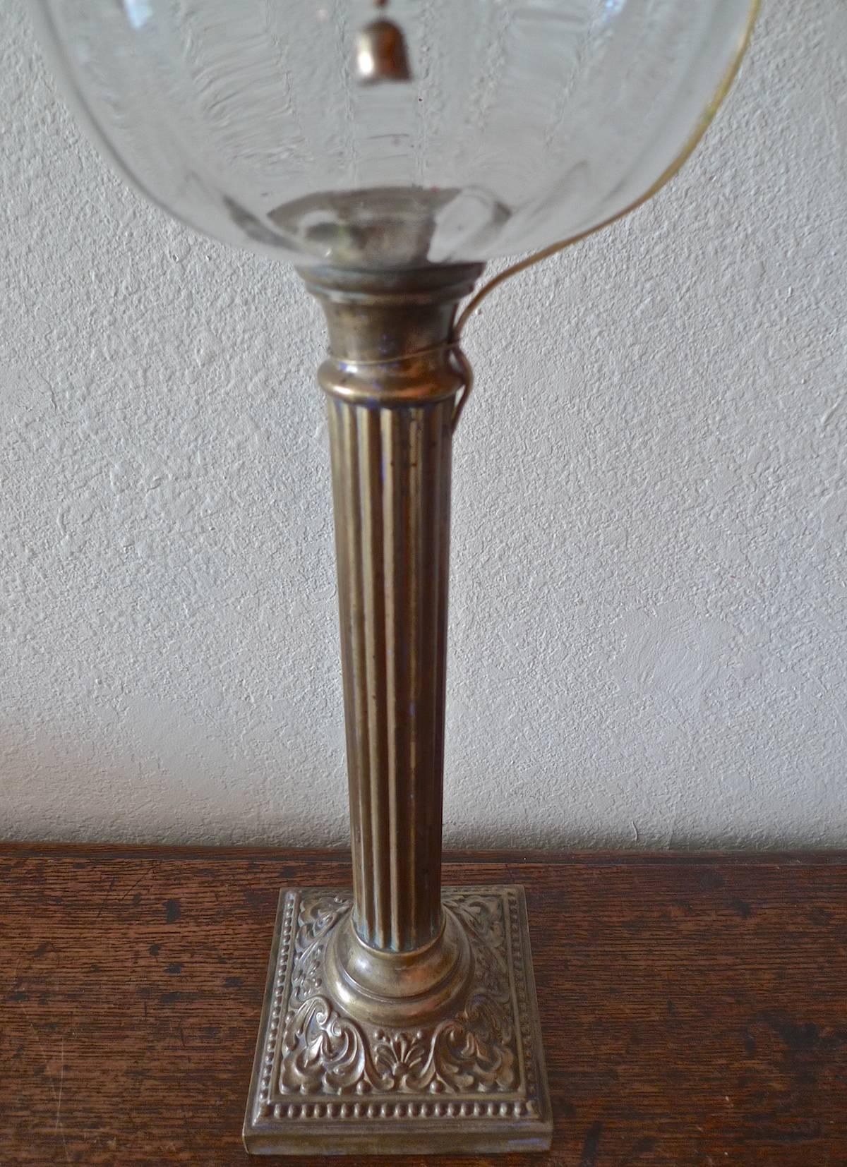 English 19th century brass and glass column table lamp.