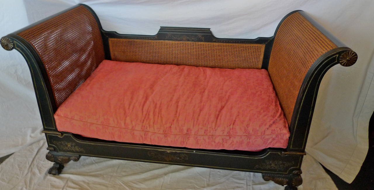 French 19th century rattan chaise longue with a long and two smaller cushions.