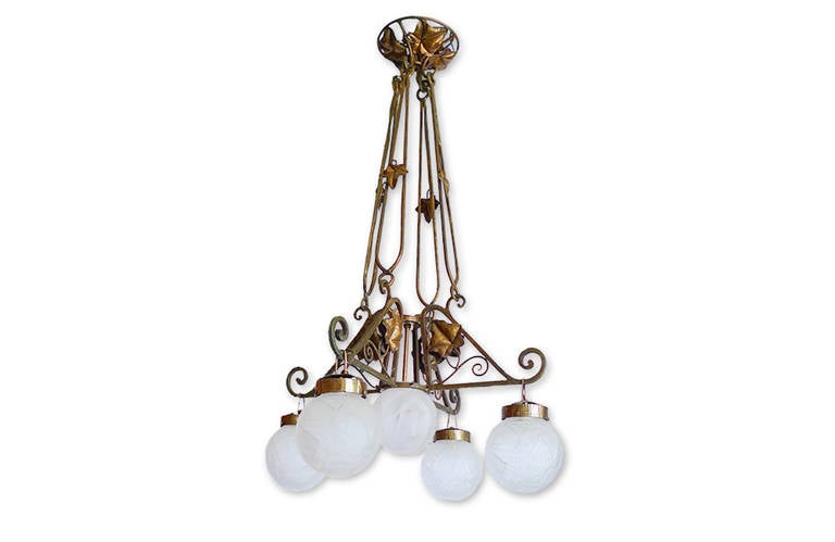 French 1920s Art Deco bronze chandelier with five lights covered by etched glass globes.
