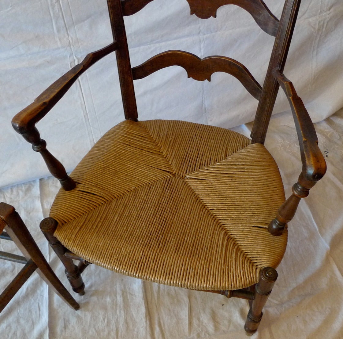 Late 19th Century French 19th Century Country Ladder Back Armchair with Rush Seat