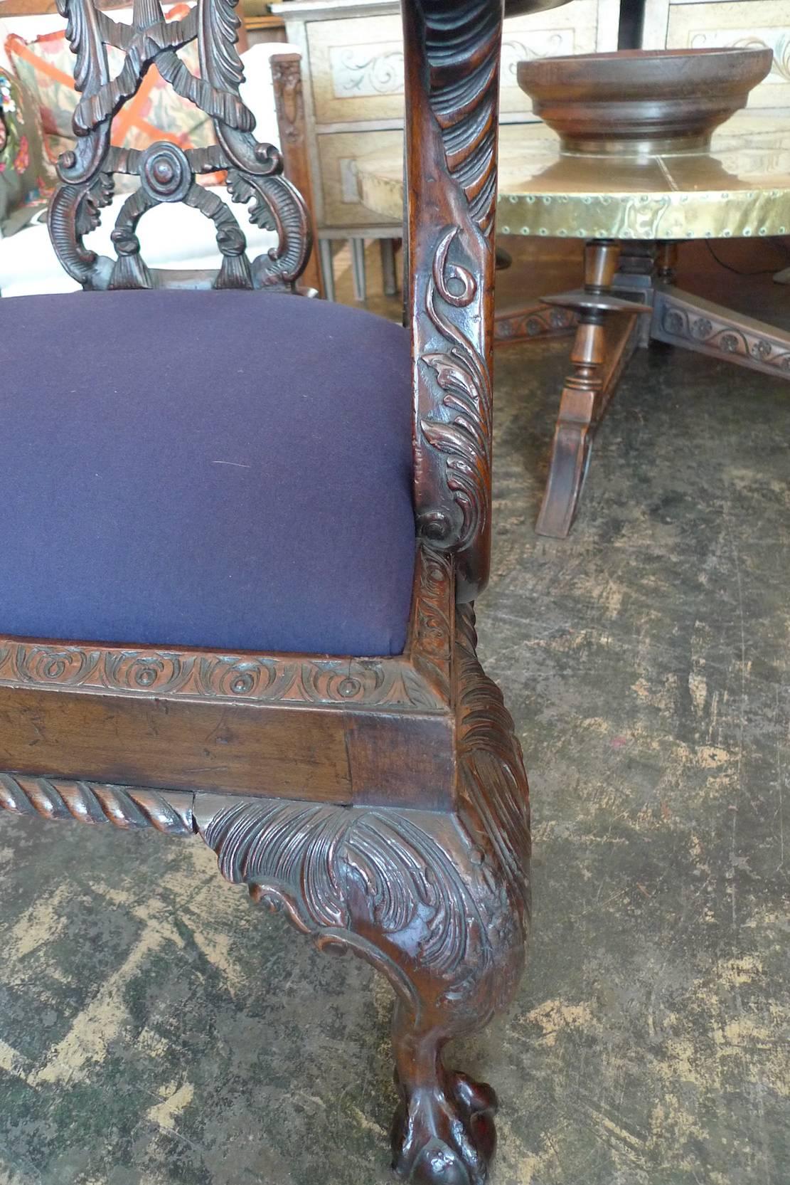 Two Irish late 18th century Georgian stained walnut re-upholstered Chippendale chairs.