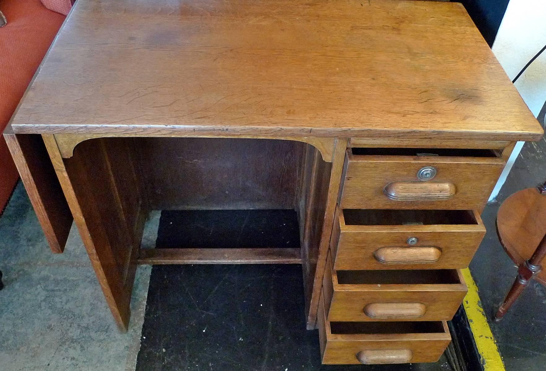 French 1940s School Writing Desk with Extension Flap and Four Drawers. In Distressed Condition In Santa Monica, CA