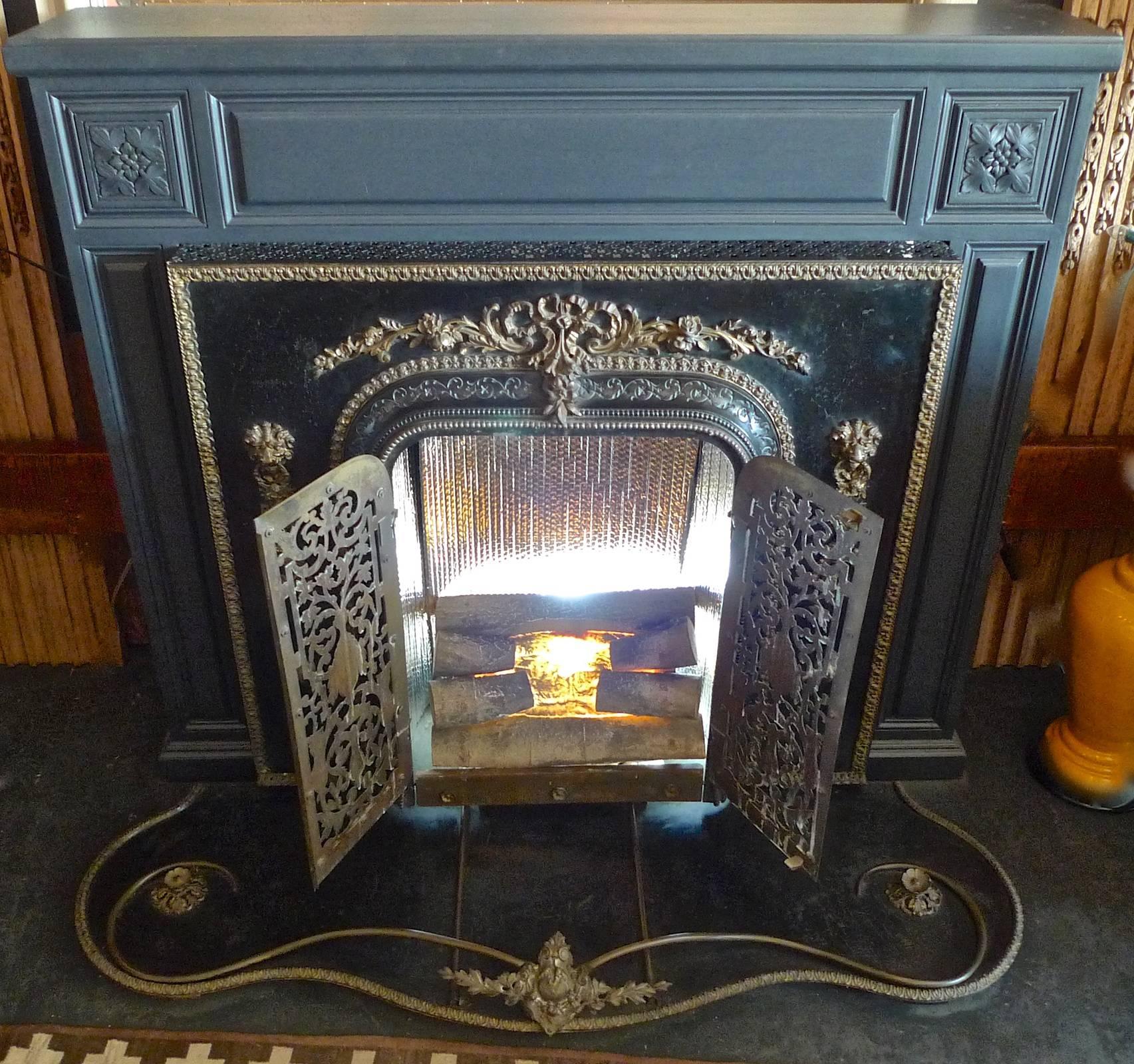 French and American 1960s metal and bronze faux electric fire place and mantel.
 