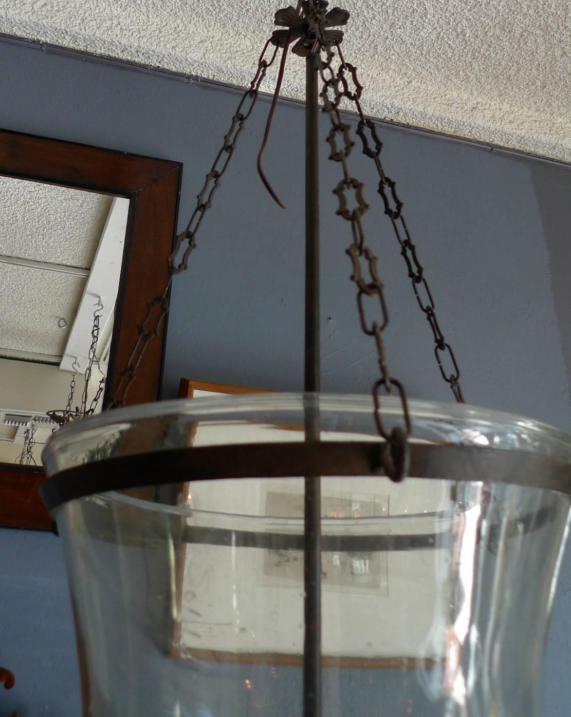 French 19th century partially frosted bell jar pendant with contemporary iron chain fittings, three-light cluster and iron finial.