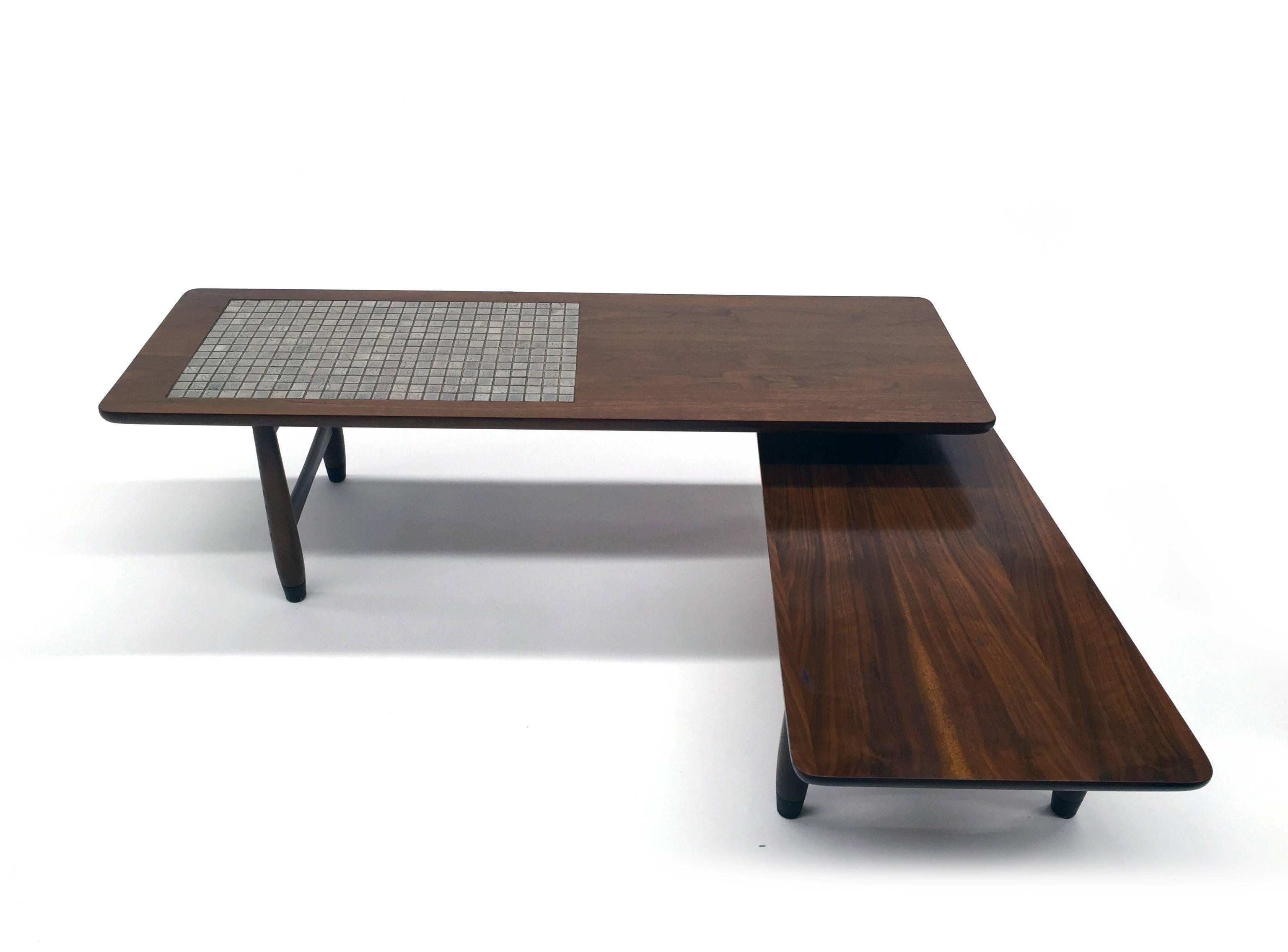 Striking American designed coffee table by Lane Furniture Company. Second tier swivels out for versatile design and functionality. Top tier has the hard to find ceramic tile that is in excellent condition.