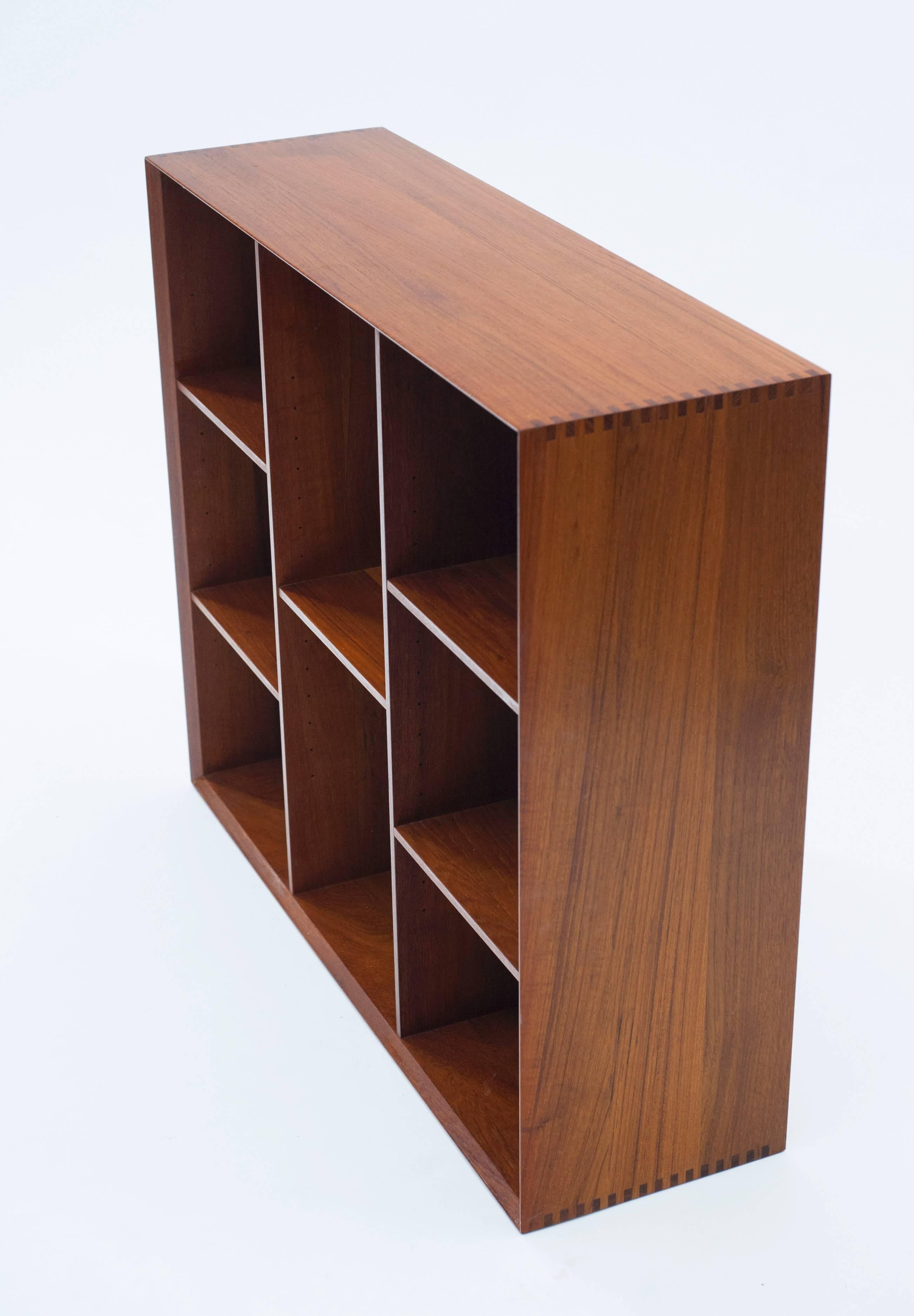 Beautifully constructed bookcase by Peter Hvidt and Orla Mølgaard-Nielsen. Bookcase is clean and in excellent condition. Exposed finger joined details and nice even patina. Case is designed to sit on top of a cabinet. More cabinets available, please