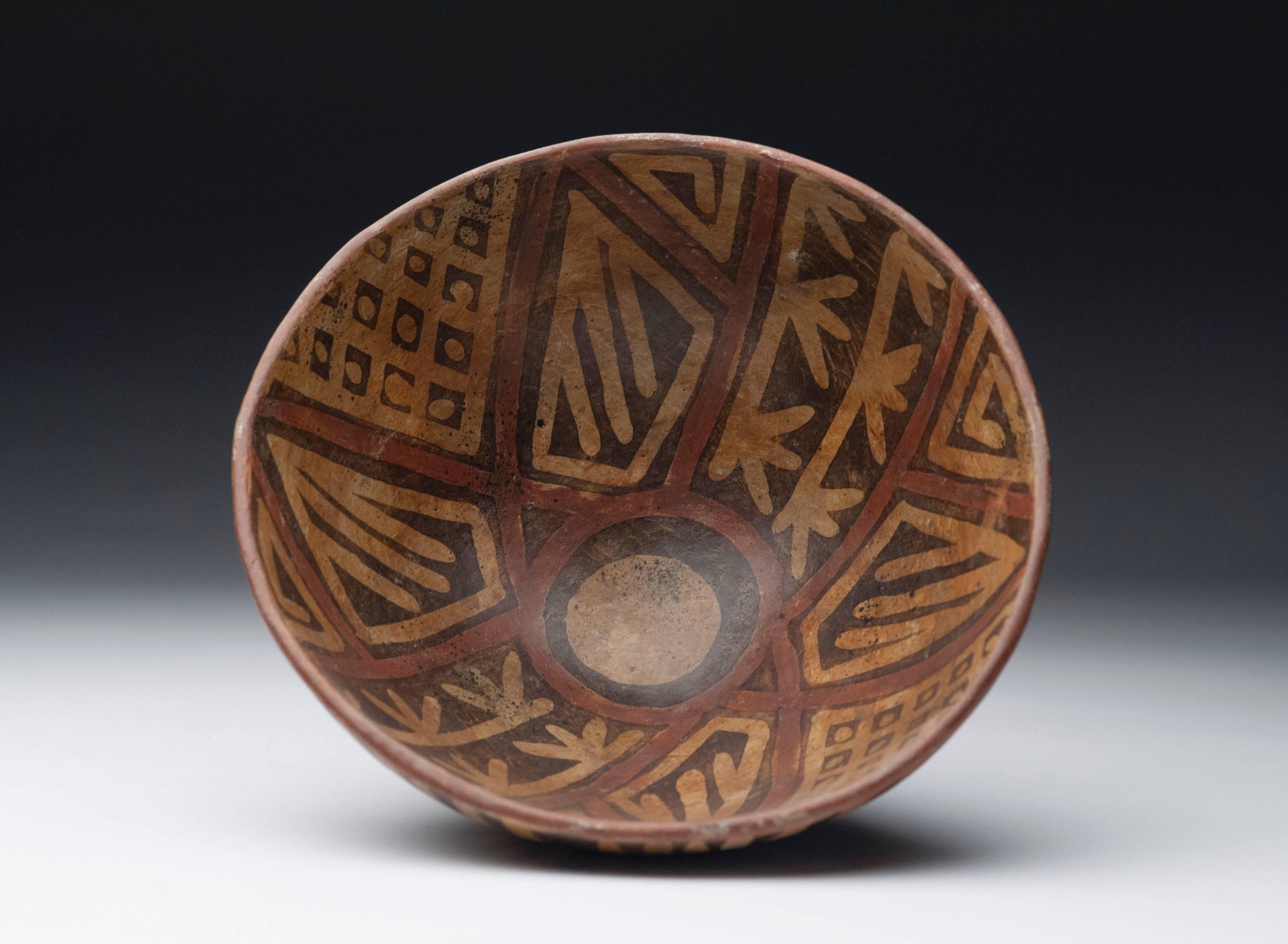 Pre-Columbian bowl from the Narino region of Columbia, circa 800 to 1500AD. Desirable polychrome bowl with vibrant color and design in black, red and tan colors. Condition is excellent.