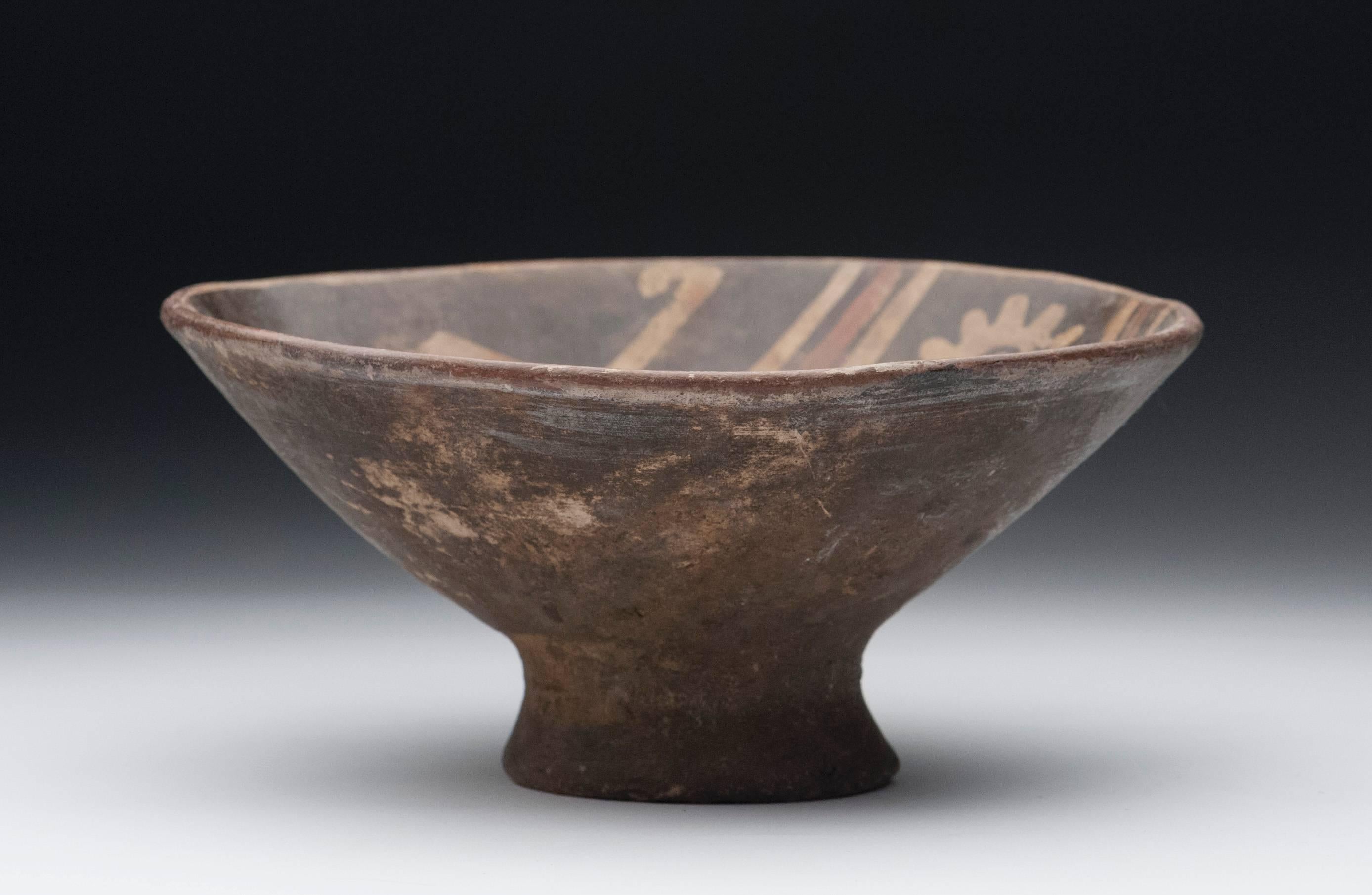 Pre-Columbian bowl from the Narino region of Columbia, circa 800 to 1500 AD. Desirable polychrome bowl with interior decorated with two monkeys.