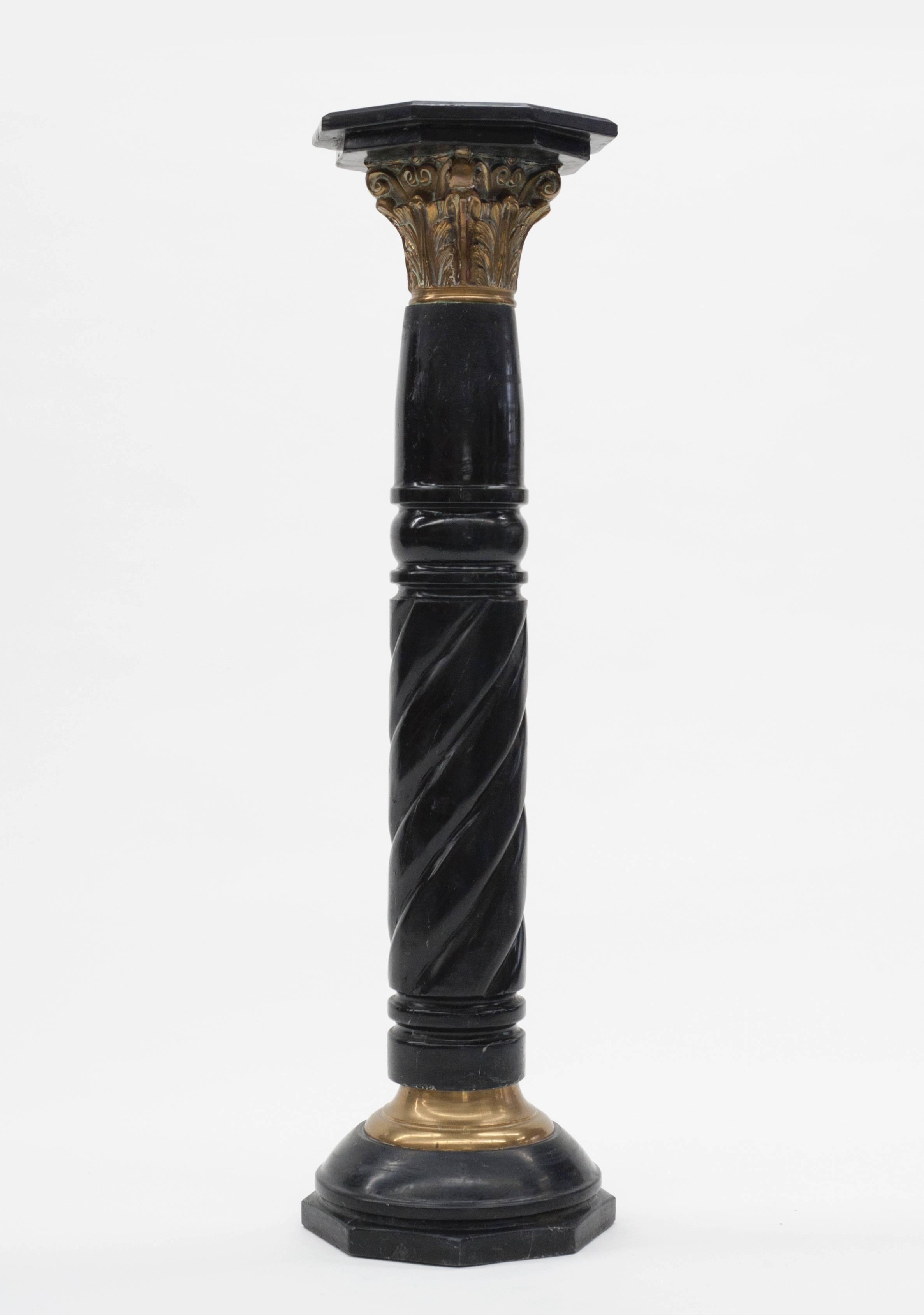 Early 20th century solid black marble pedestal with brass mounts.  Beautiful piece for displaying sculpture.