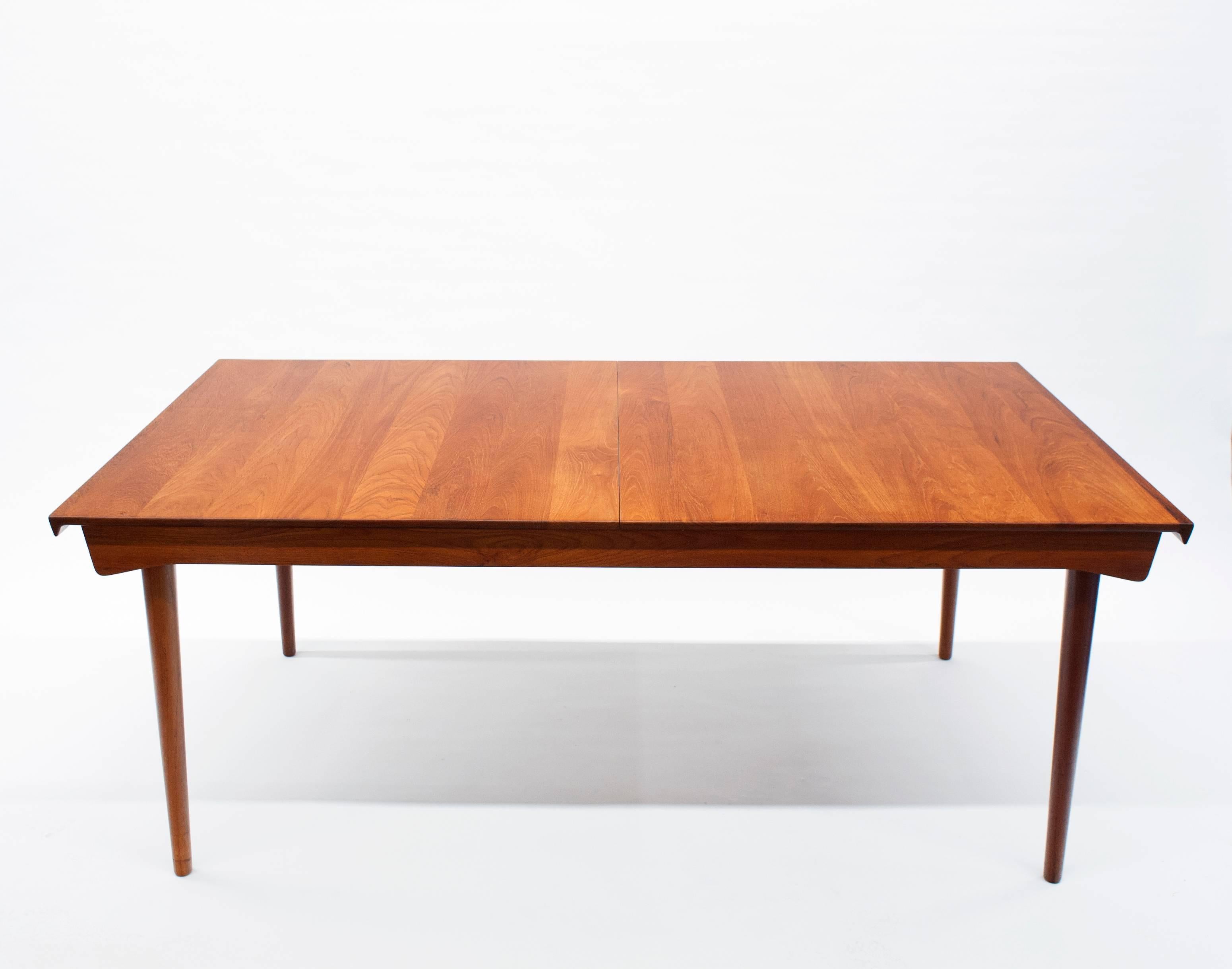 Beautifully designed and constructed dining table by Danish master designer Finn Juhl. Table comes with two original leaves that are stored within the table.
Table measures 72 W x 39.5 D x 28.5 H. Each leaf is 19.5 W. Fully extended table is 112