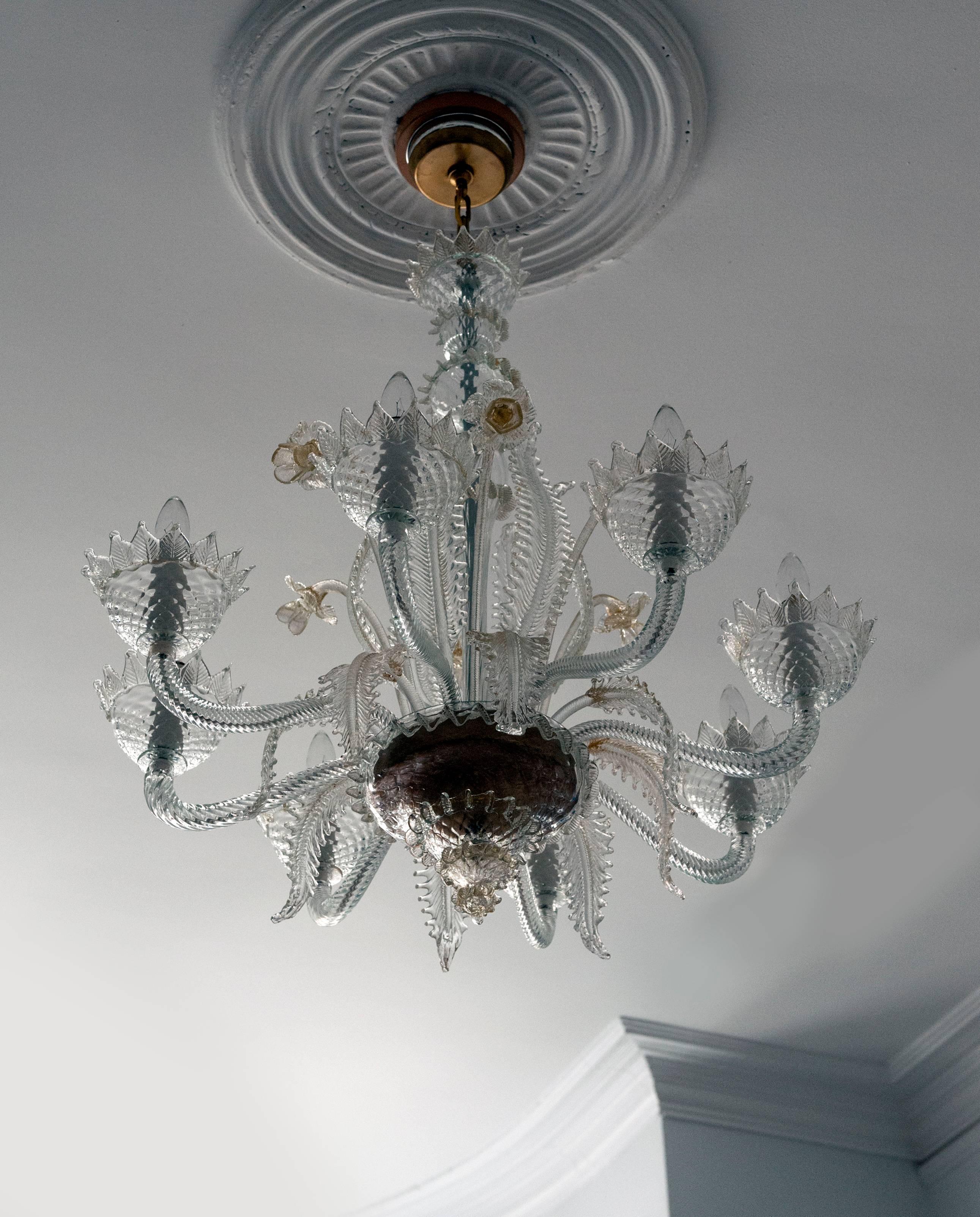 Exceptional and large Venetian glass chandelier from Italy, circa 1950.  Chandelier has eight arms and has been rewired. Condition is excellent.  Measures 35