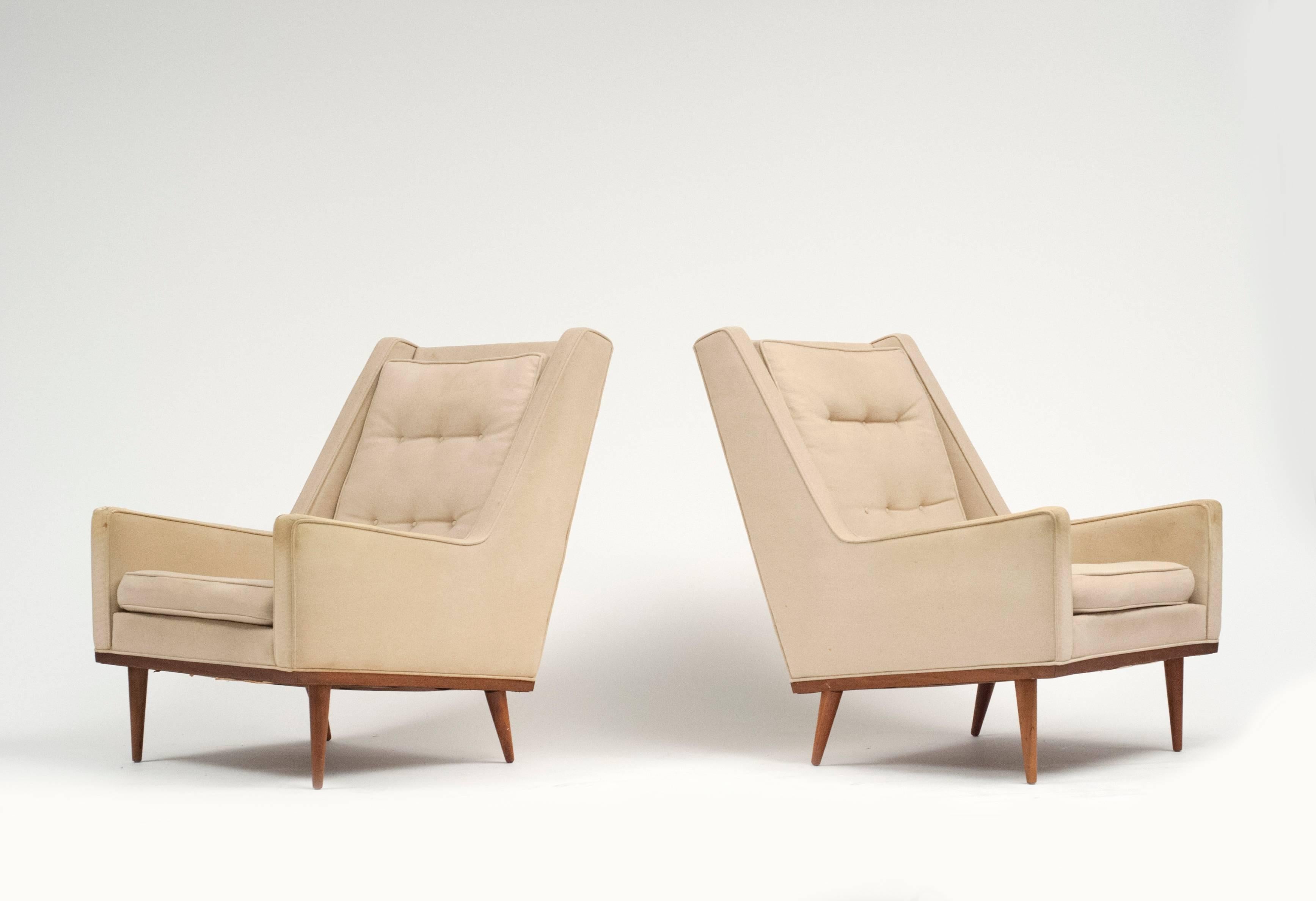 Early pair of Milo Baughman designed lounge chairs for Thayer Coggin. Each chair retains both a James Inc. label and Thayer Coggin label.  Thayer Coggin founded James Inc. and it evolved into Thayer Coggin.  Chairs need to be reupholstered.  Classic