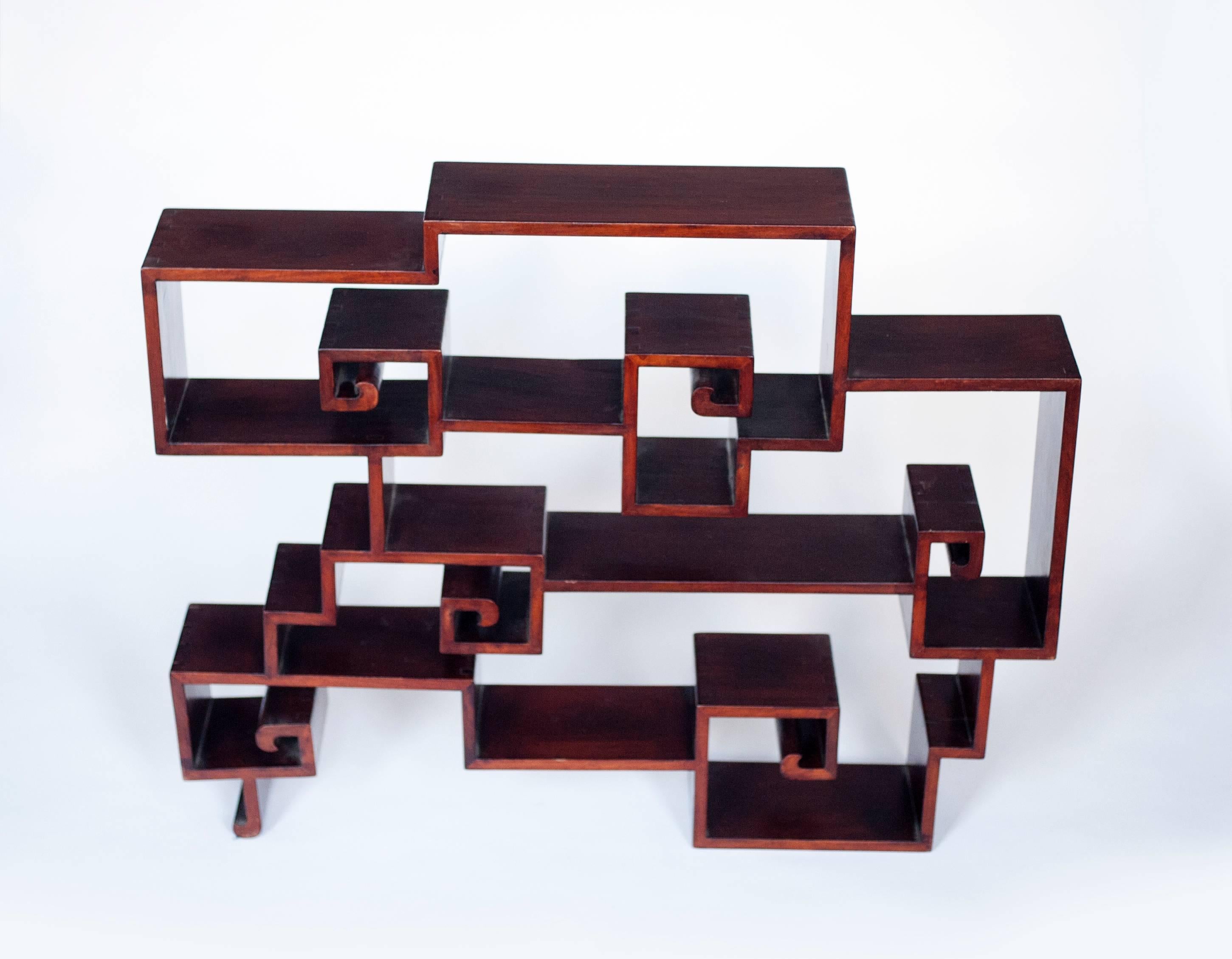 Beautiful and exceptionally made shelf, late 19th century Chinese. Piece is heavy and a work of art. Every 90 degree angle is dovetail joined. Could work on top of a cabinet or attached to a wall. Measures: 30