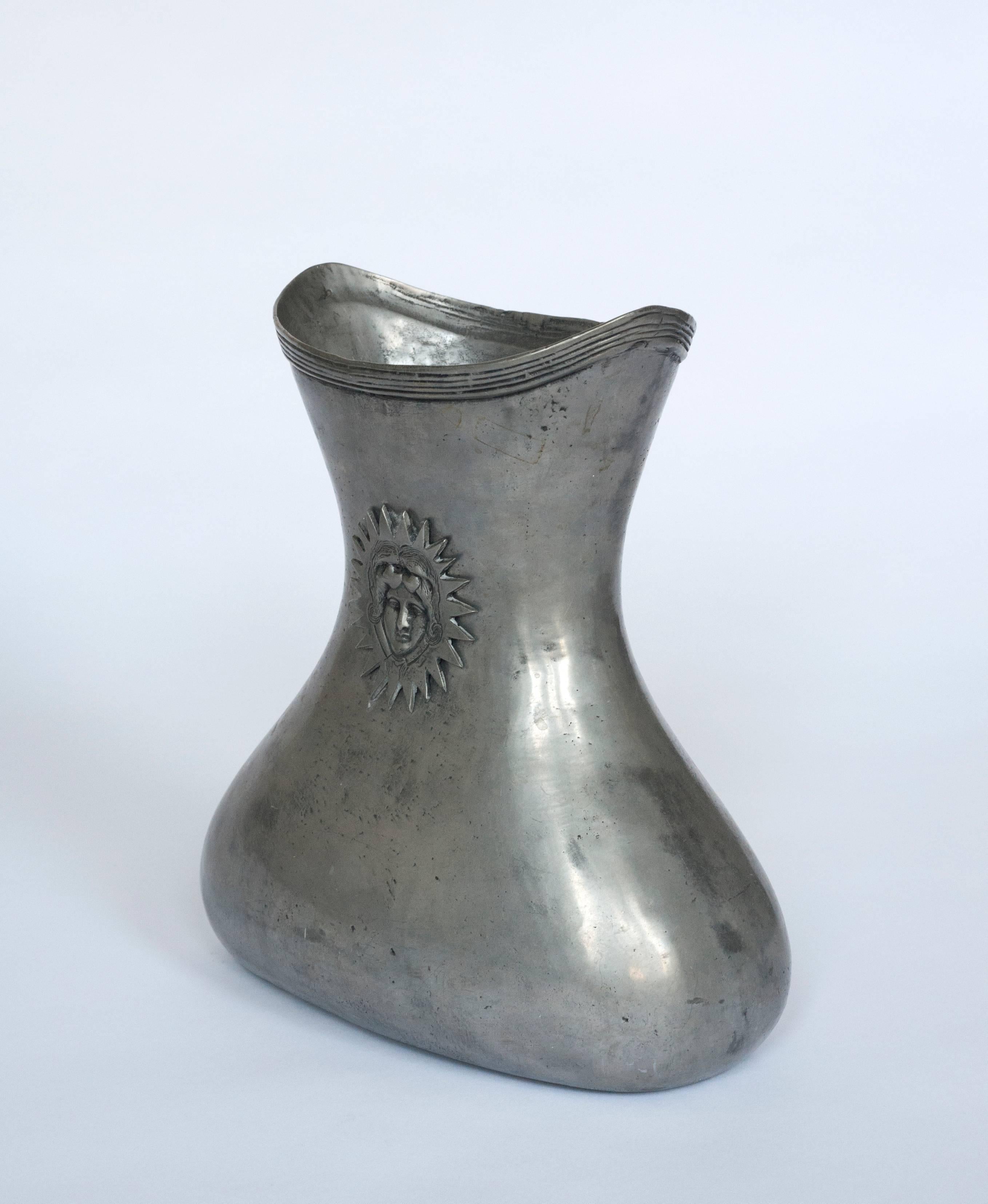 Beautifully shaped handmade pewter vessel.  It is solid and heavy.  Stamped on bottom 