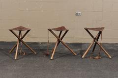 Three French Folding Wooden Stools with Brown Leather Seats and Tripod Base